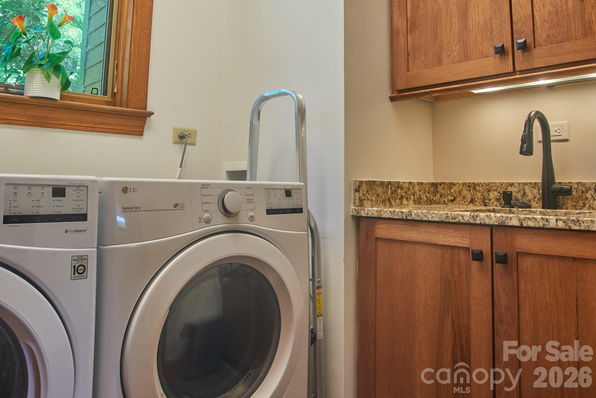 Main level - Laundry Room with vanity and sink - 427 Spring Rock Road, Burnsville