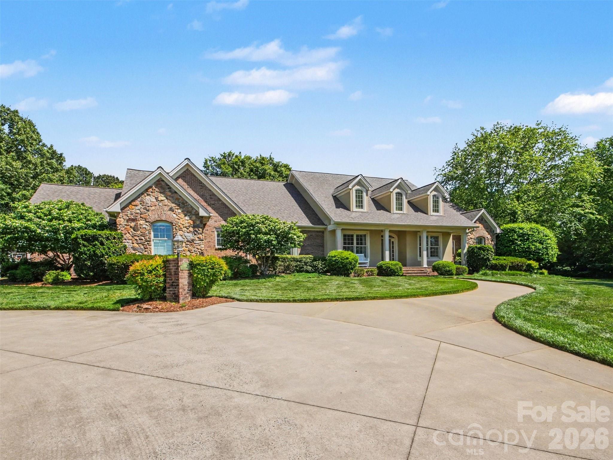 French provincial architecture with brick and stone accents on a level 1.75 acre private lot... - 1422 Stone Gate Drive, Shelby