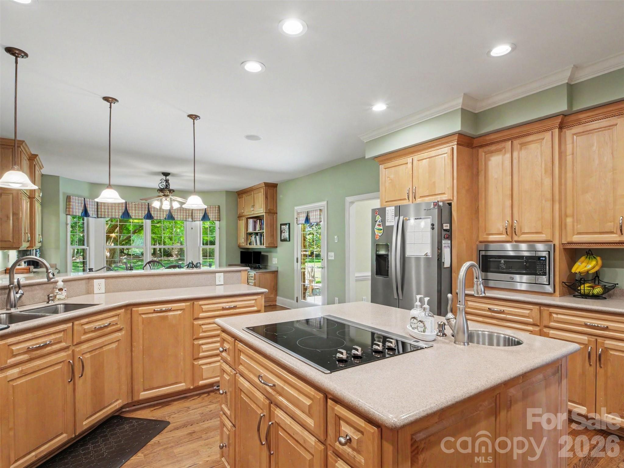 ...recessed and pendant lighting, plus stainless steel appliances. - 1422 Stone Gate Drive, Shelby