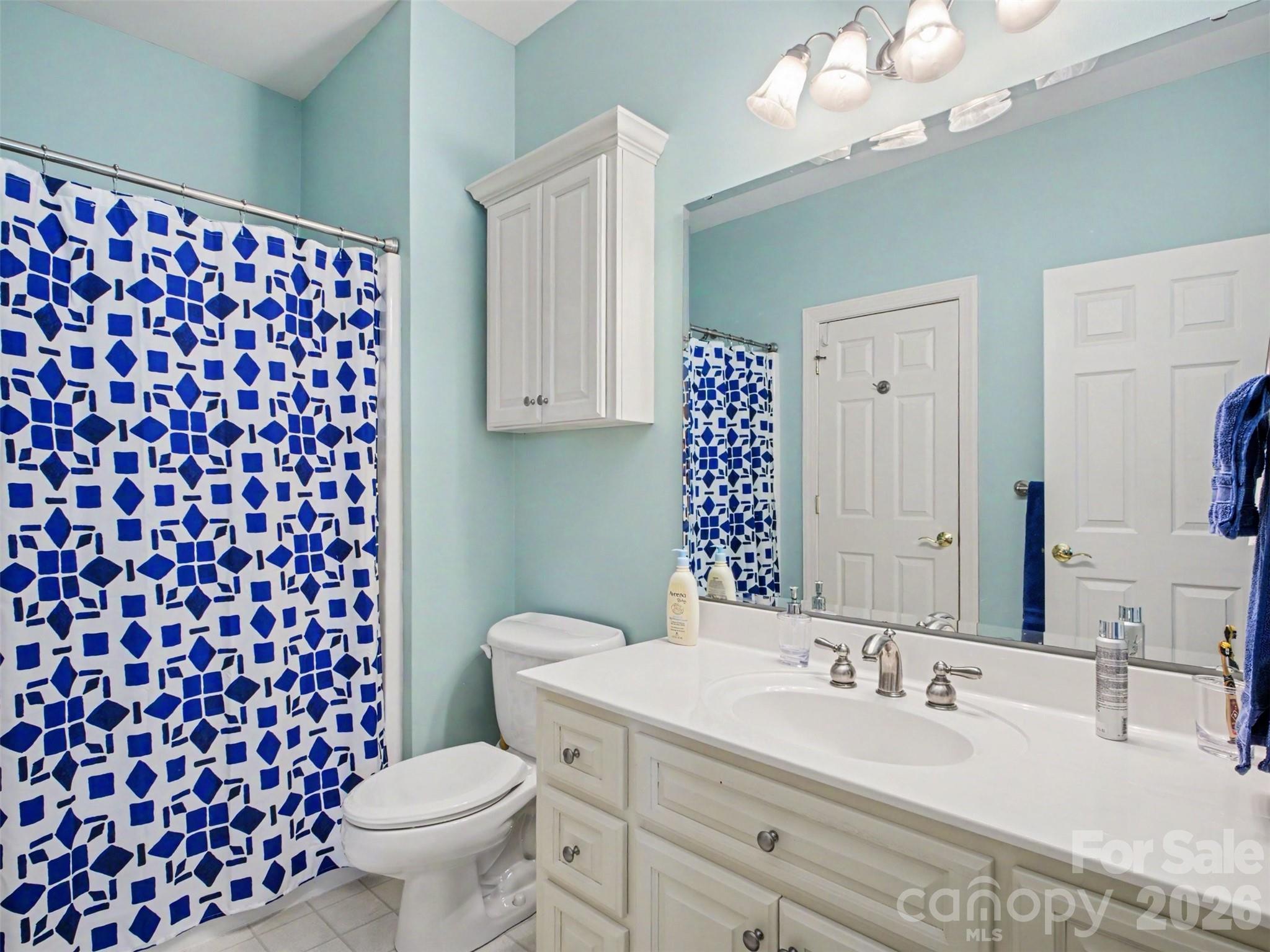 The second bedroom has an ensuite full bath - 1422 Stone Gate Drive, Shelby