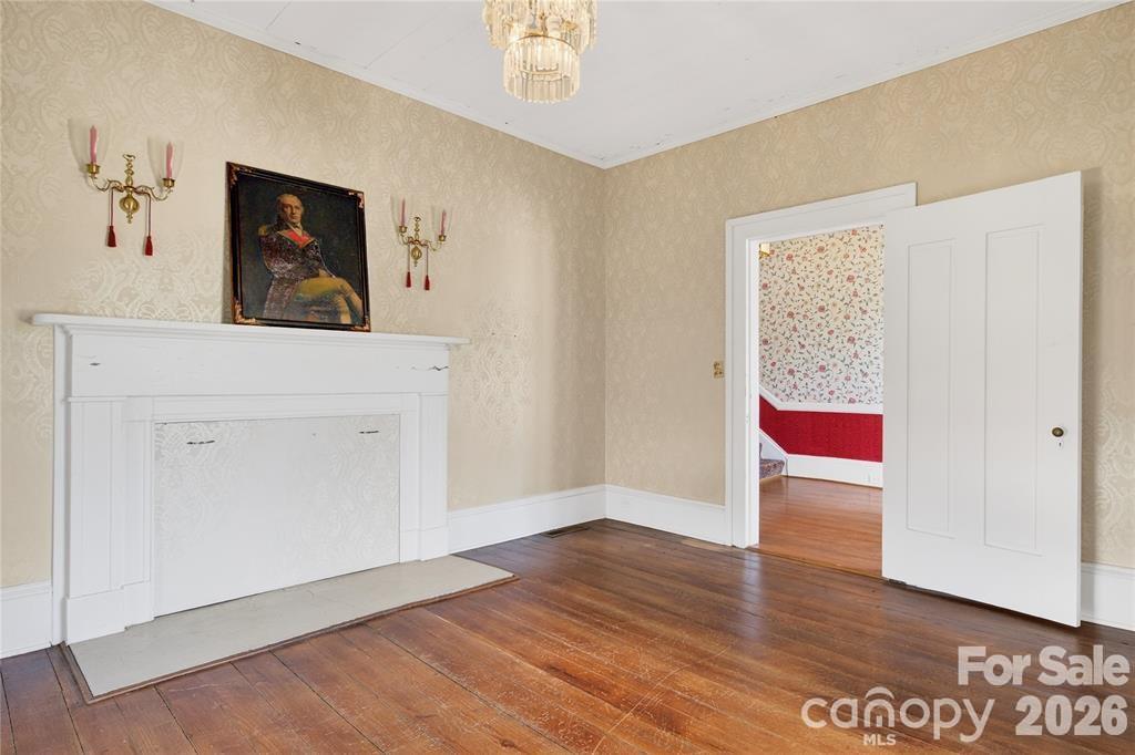 Front parlor with heart pie floors and historic mantlepiece - 11124 Eastfield Road, Huntersville