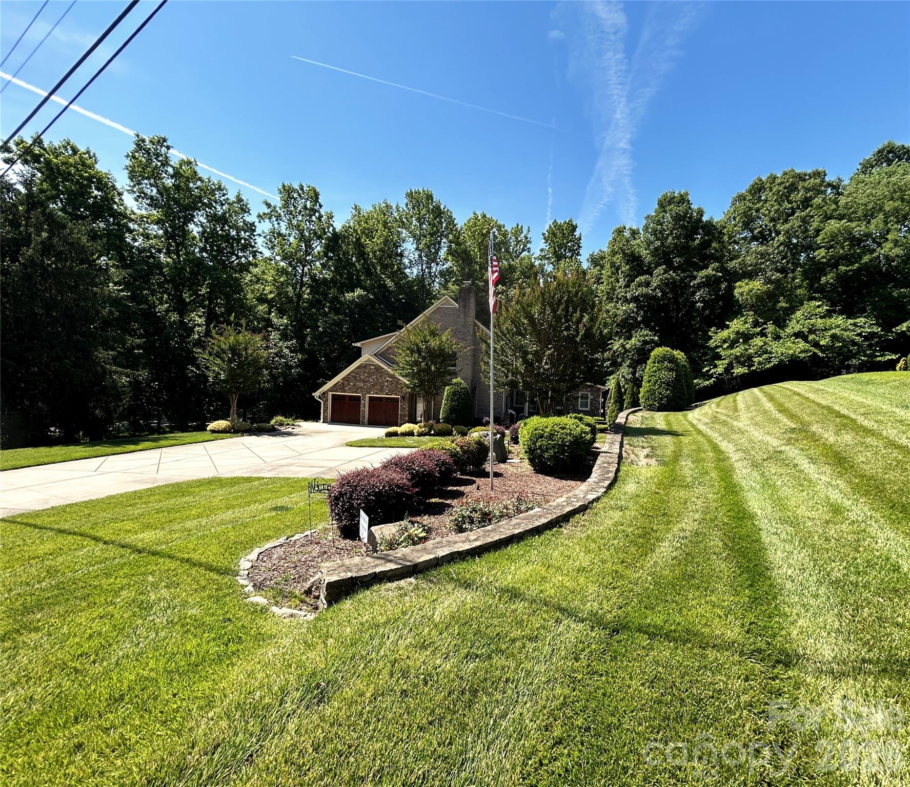 Almost Acre setting with large driveway to side-load Garage - 900 Courtney Court SE, Concord