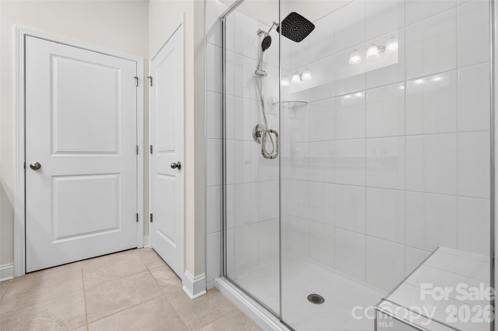 Spacious shower with bench. - 4192 Steel Way, Sherrills Ford
