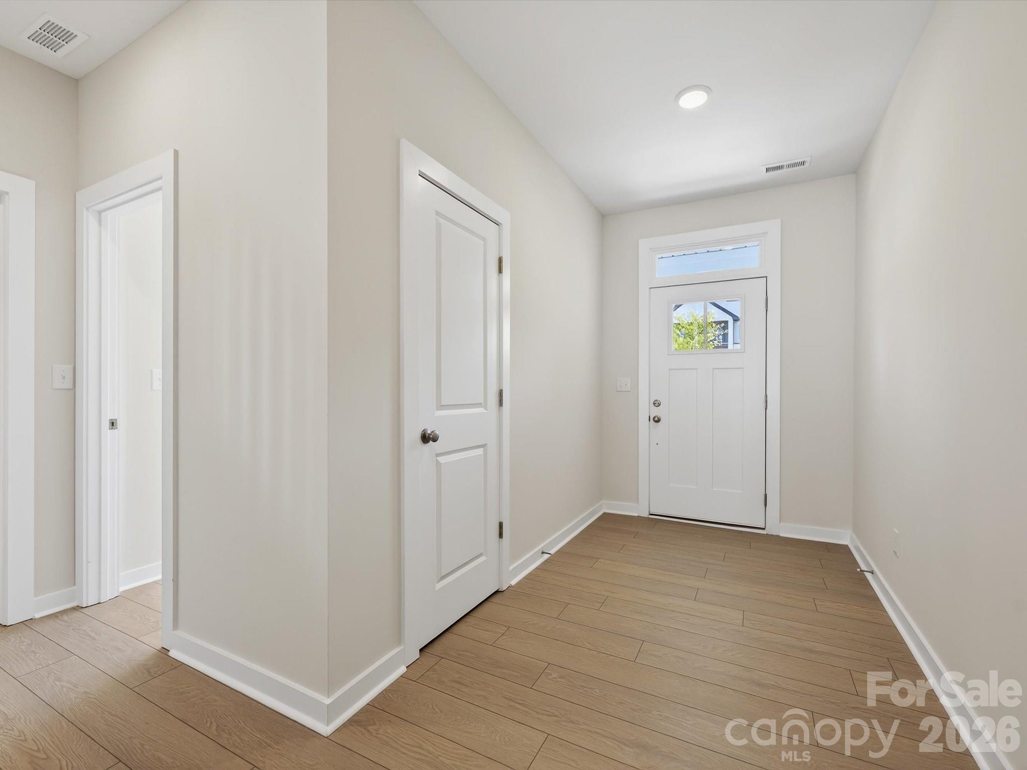 Foyer with coat closet and entrance to Bedroom #4 - 11427 Prosperity Church Road, Huntersville