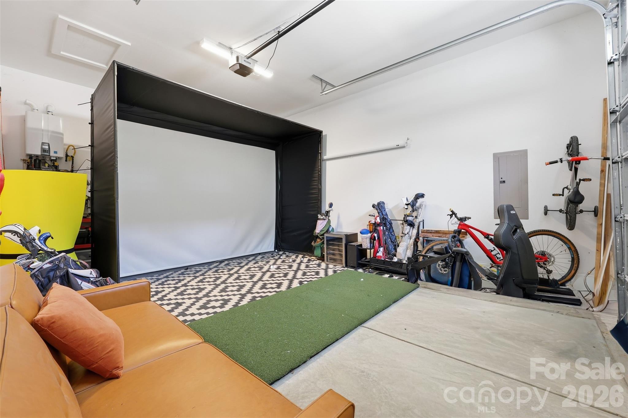 3rd bay garage used for golf simulator - 931 Cornelius Road, Mooresville