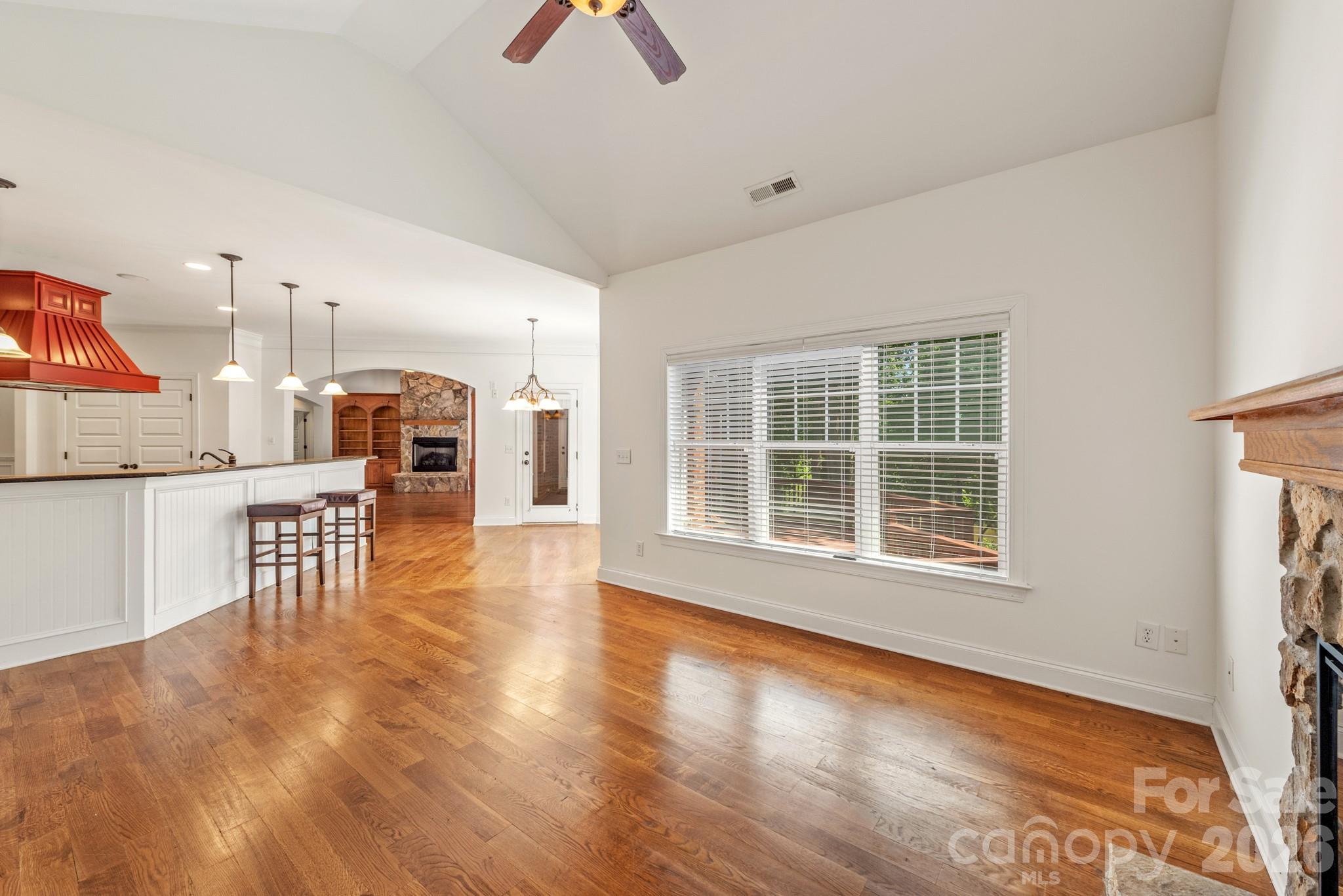 Gathering room with kitchen island and breakfast area. - 4709 Rockwood Drive, Waxhaw