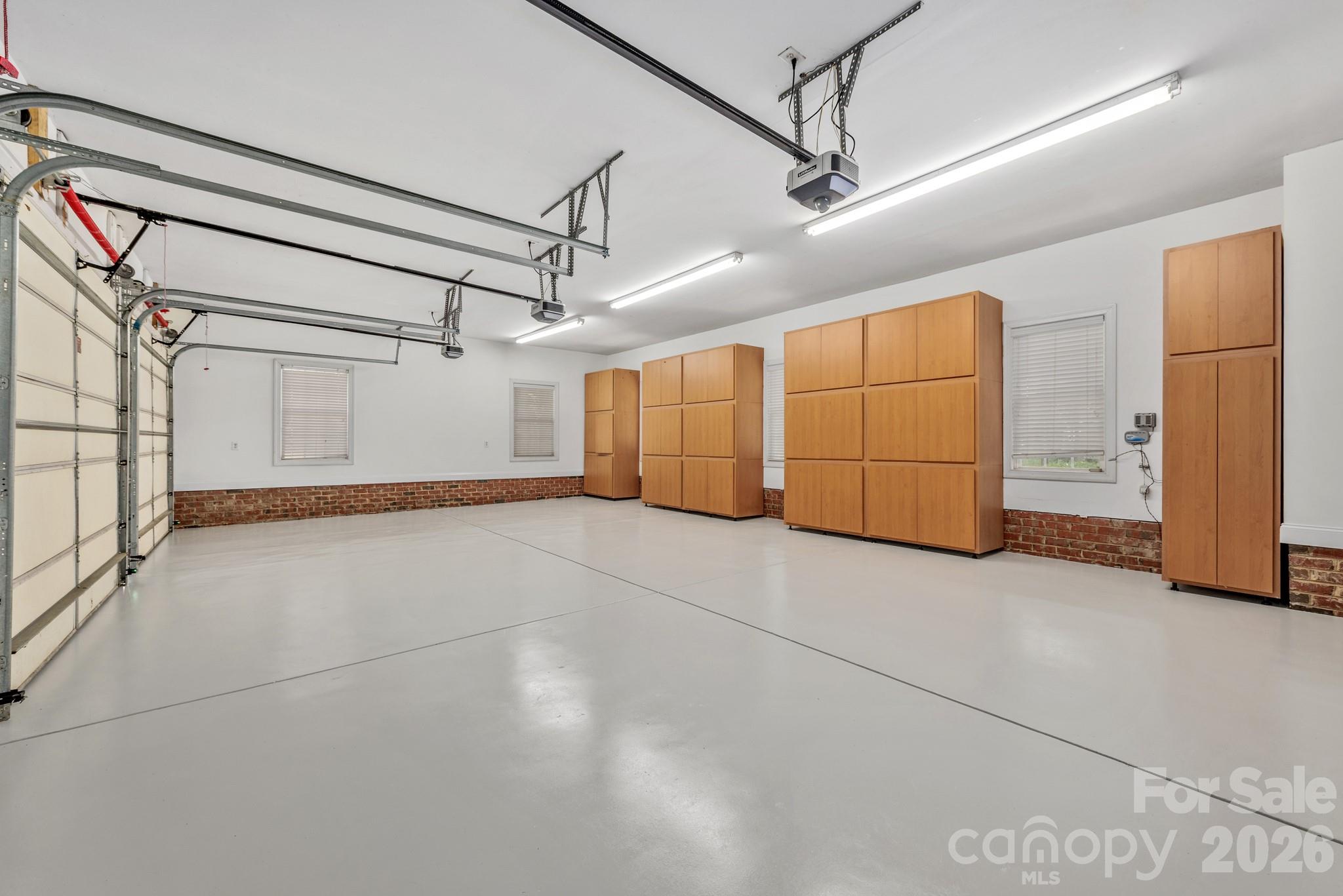 Garage storage and epoxy floor. - 4709 Rockwood Drive, Waxhaw