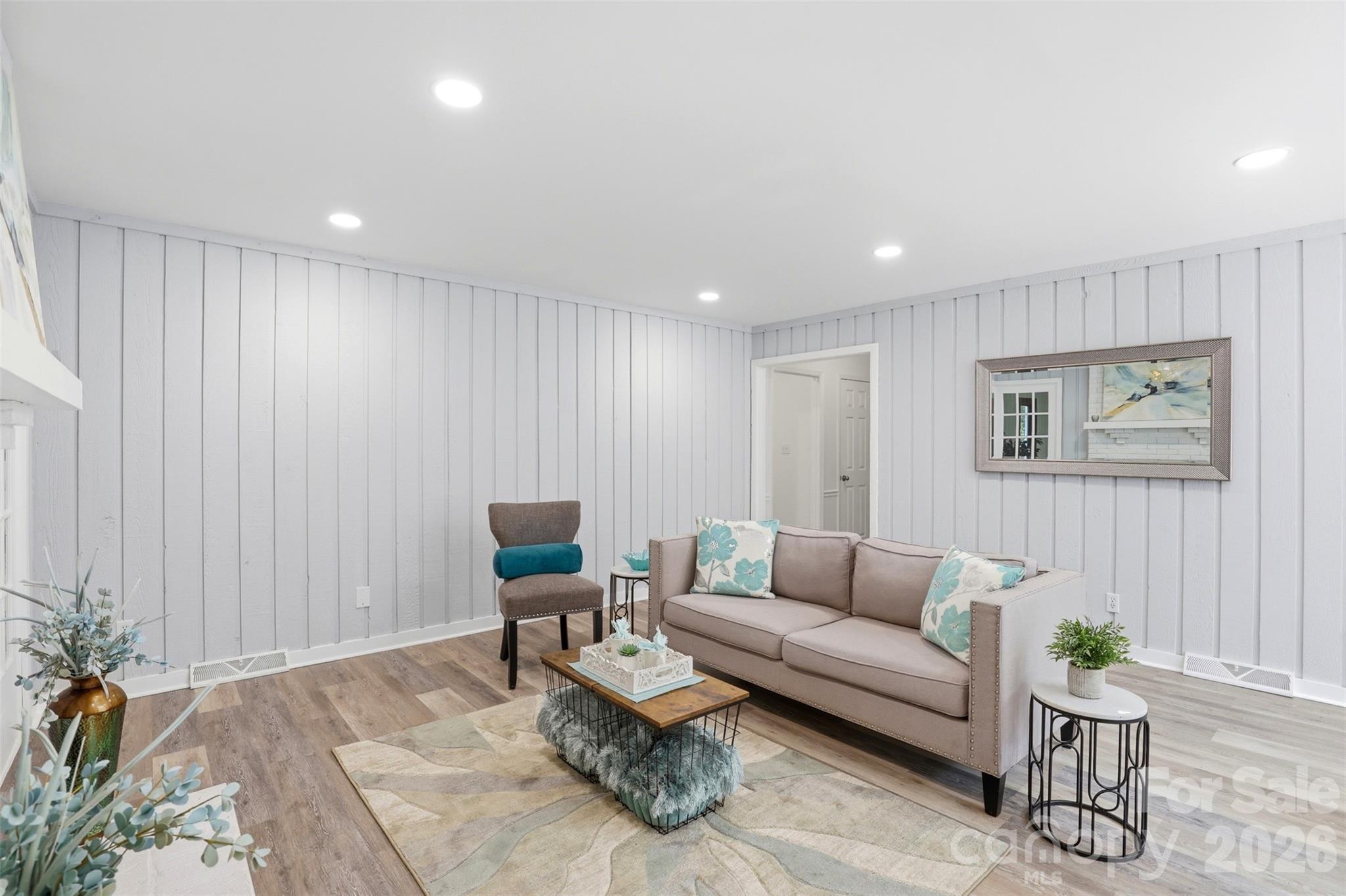 Textured walls add to the sense of coziness in this room located at the center of the home - 9624 Central Drive, Mint Hill