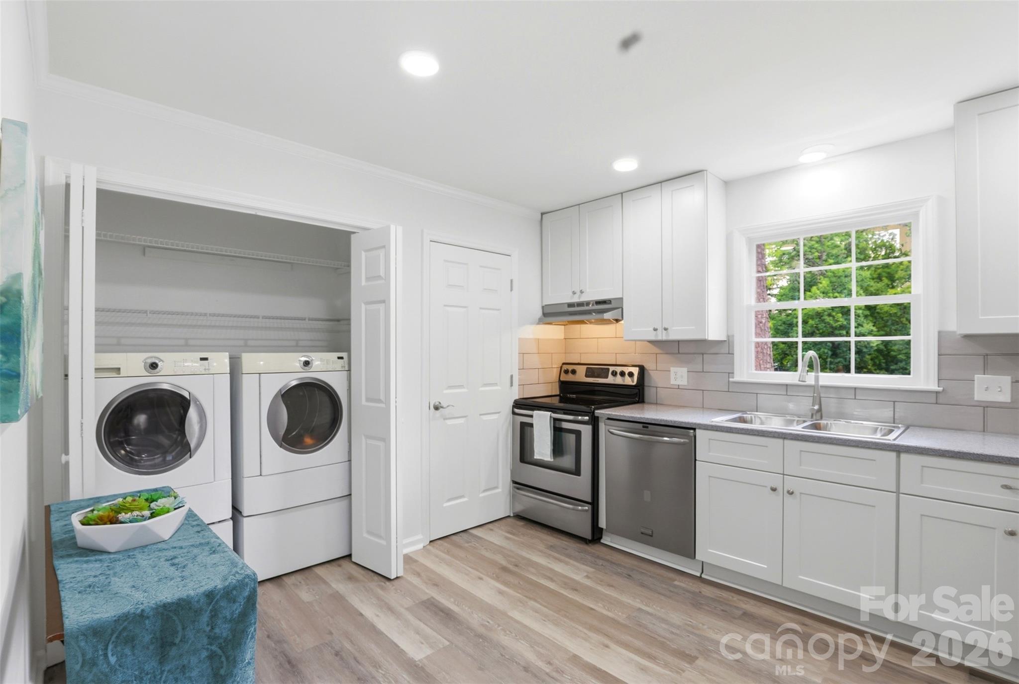A view of laundry closet with doors open! - 9624 Central Drive, Mint Hill