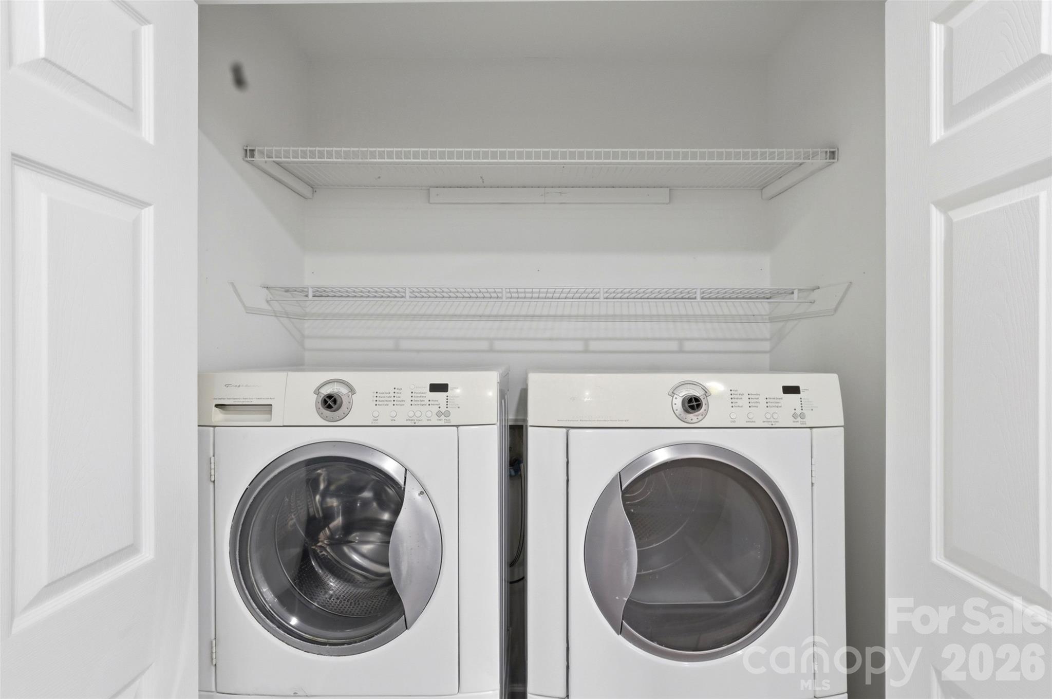 Elevated washer and dryer remain with sale of home. Lots of overhead storage! - 9624 Central Drive, Mint Hill