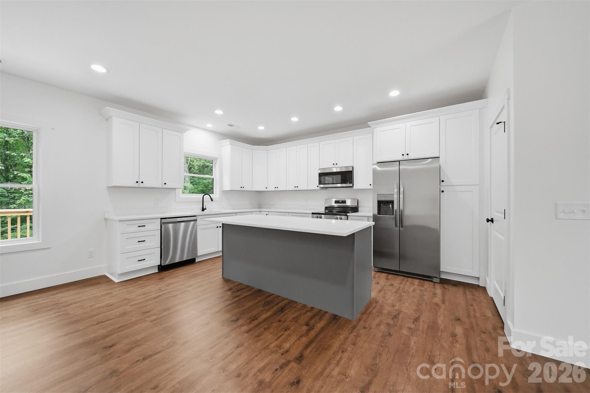 Custom cabinetry with center island. - 414 Scarlett Oak Court NE, Lenoir