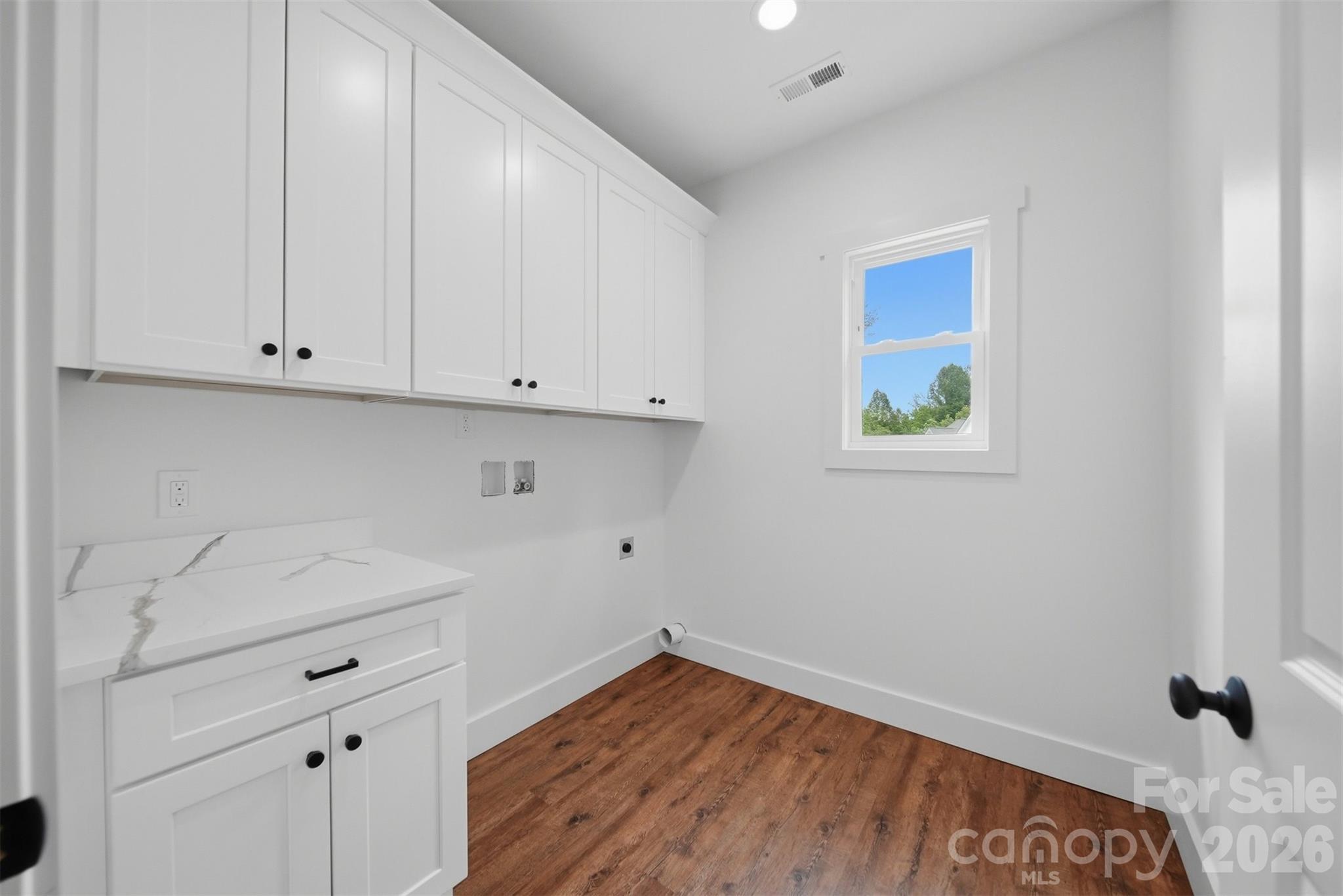 A large laundry room. - 414 Scarlett Oak Court NE, Lenoir