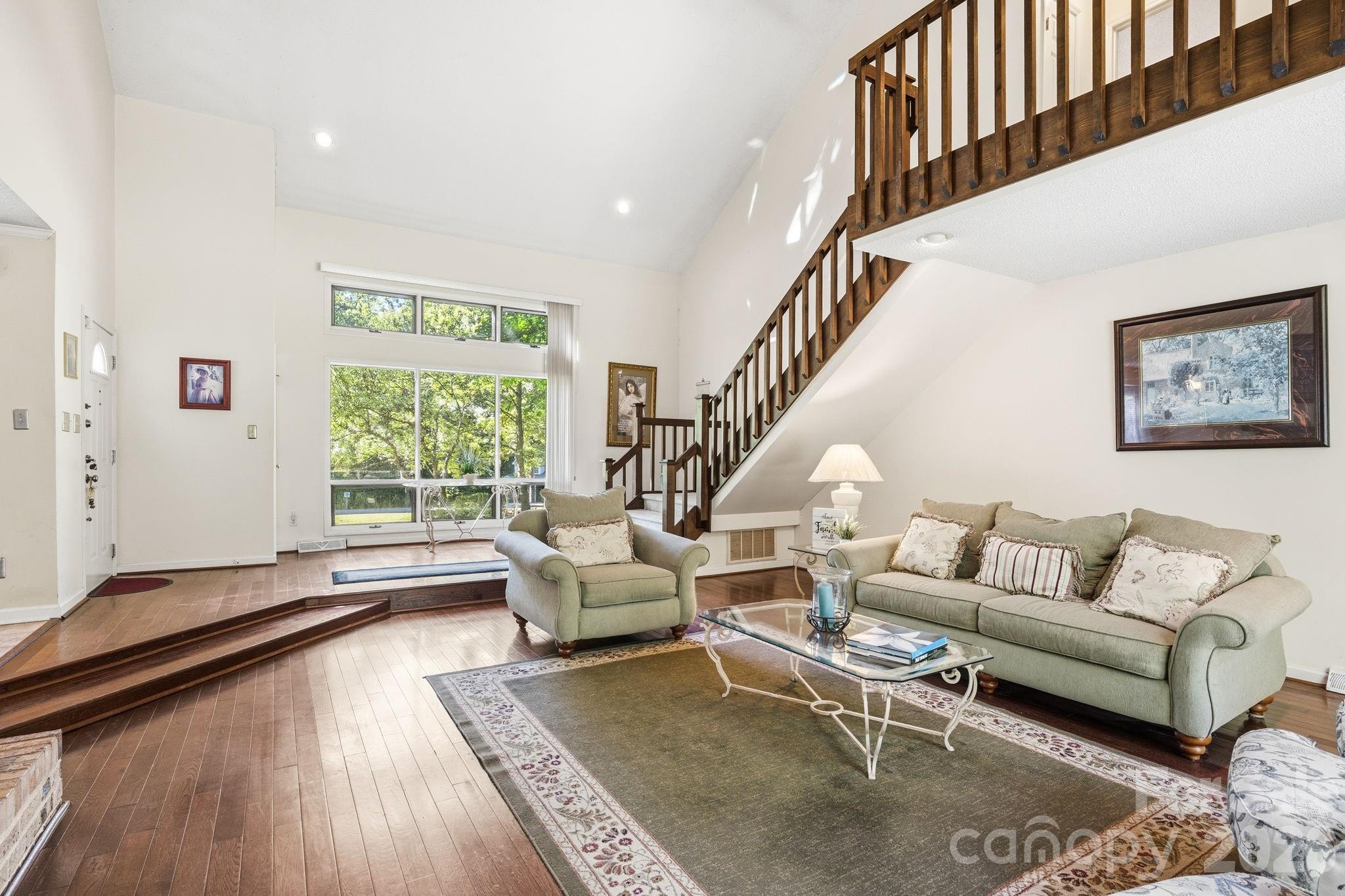 View of Great Room from the glass siding doors connecting to the deck in the backyard. - 1775 Apple Tree Lane, Fort Mill