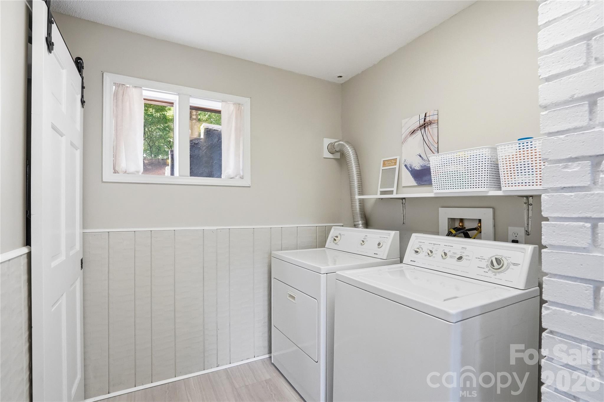 stylish laundry room complete with a trendy barn door - 1113 Palmyra Drive, Tega Cay