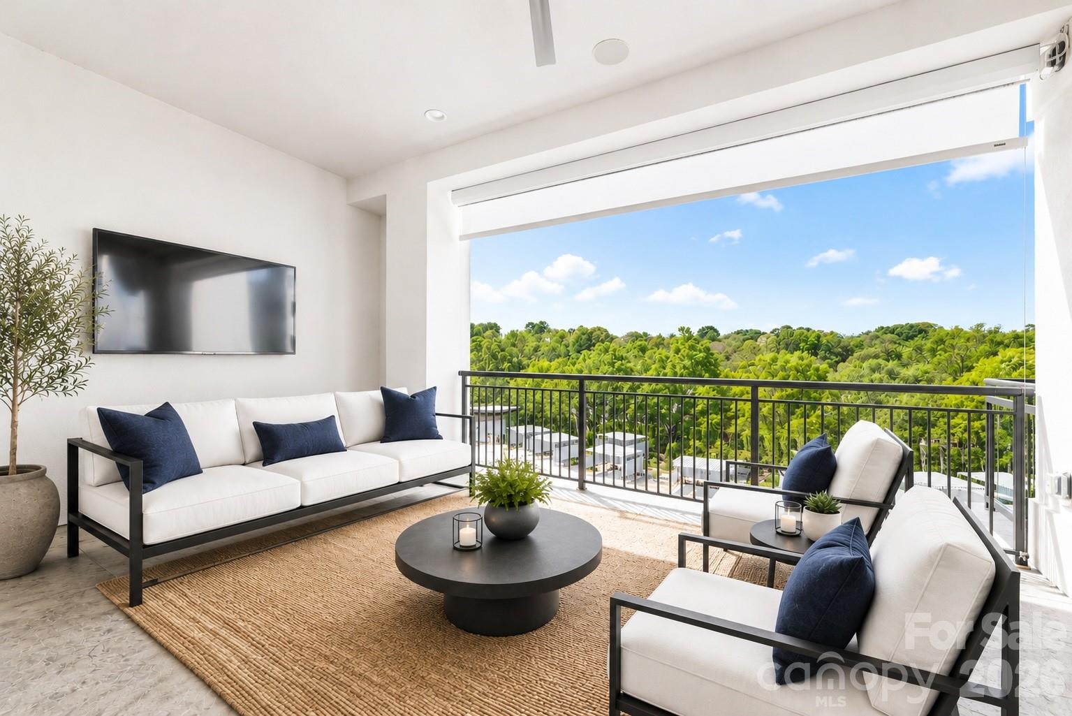 Virtually Staged lanai with electronic shades  and ceiling fan - 19329 Watermark Drive, Cornelius