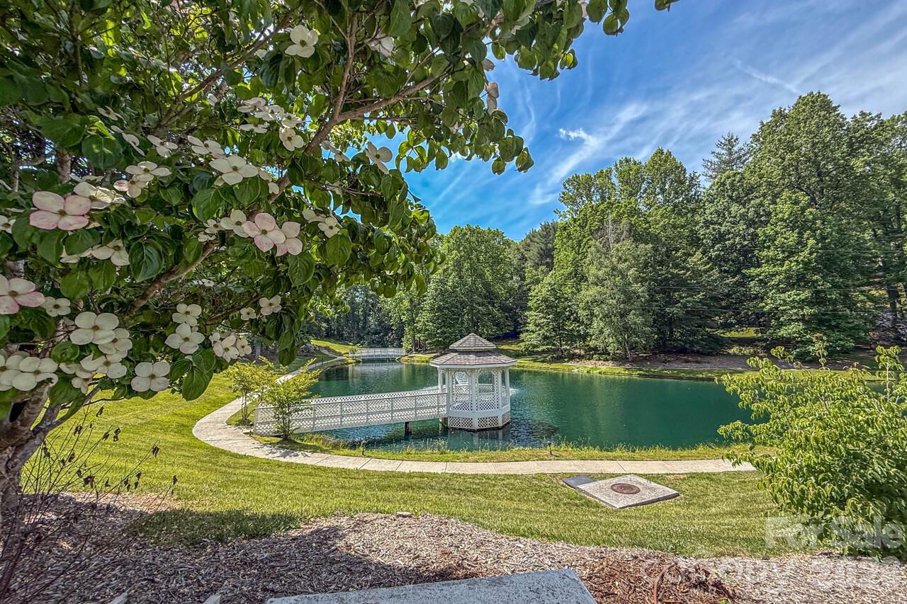 Spectacular Pond with walking trails at entry of community - 606 Carriage Commons Drive, Hendersonville