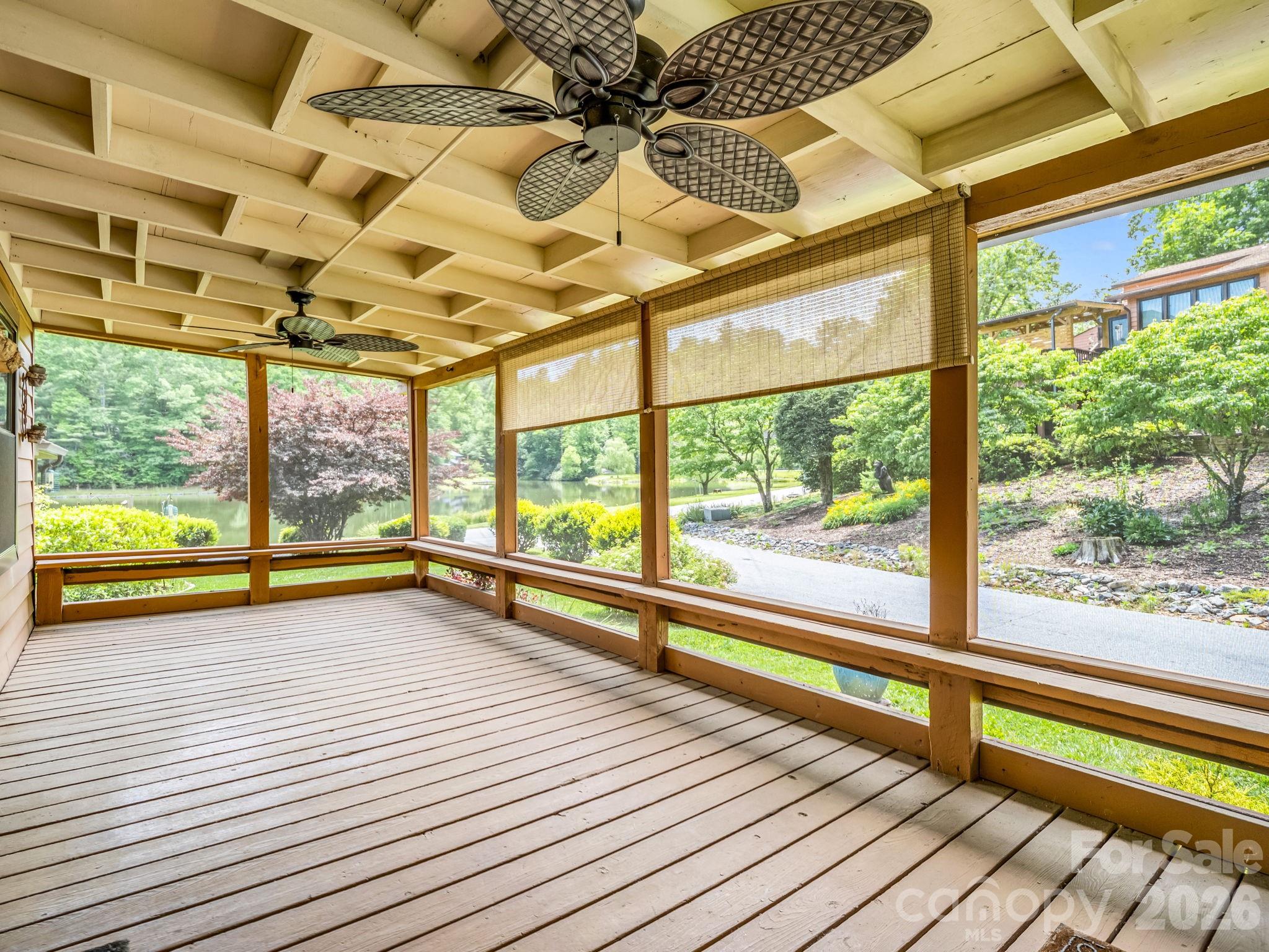 Screened in porch with fan. Seller left the grill and propane tank that convey. - 117 Willow Way, Hendersonville