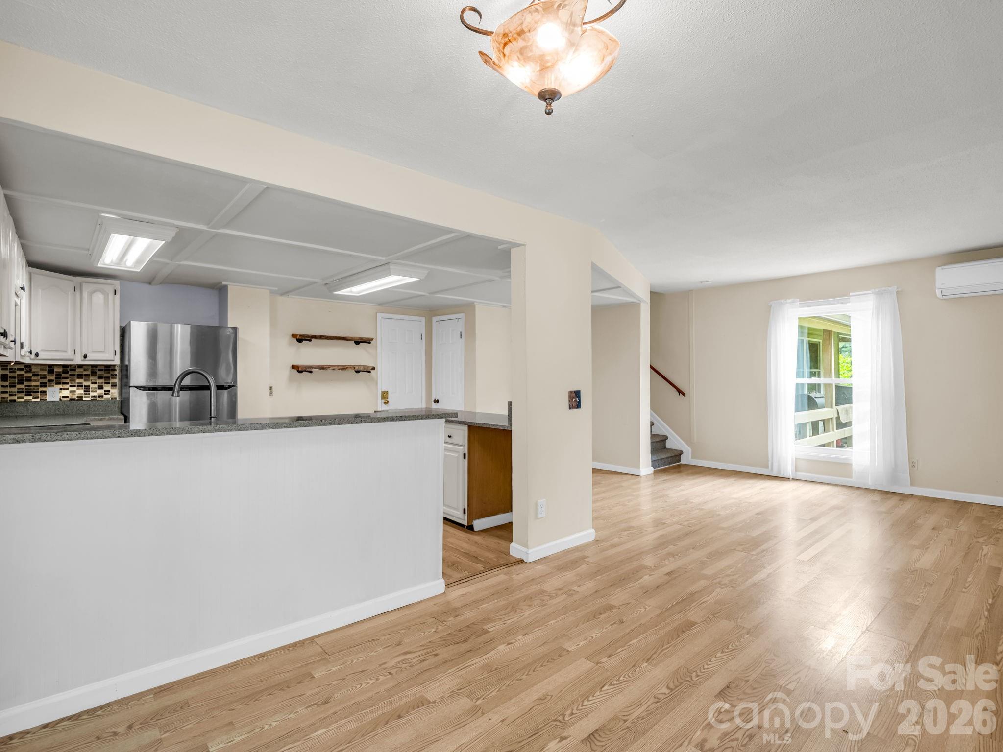 From dining area looking into kitchen, sliding doors to screened porch are behind - 117 Willow Way, Hendersonville