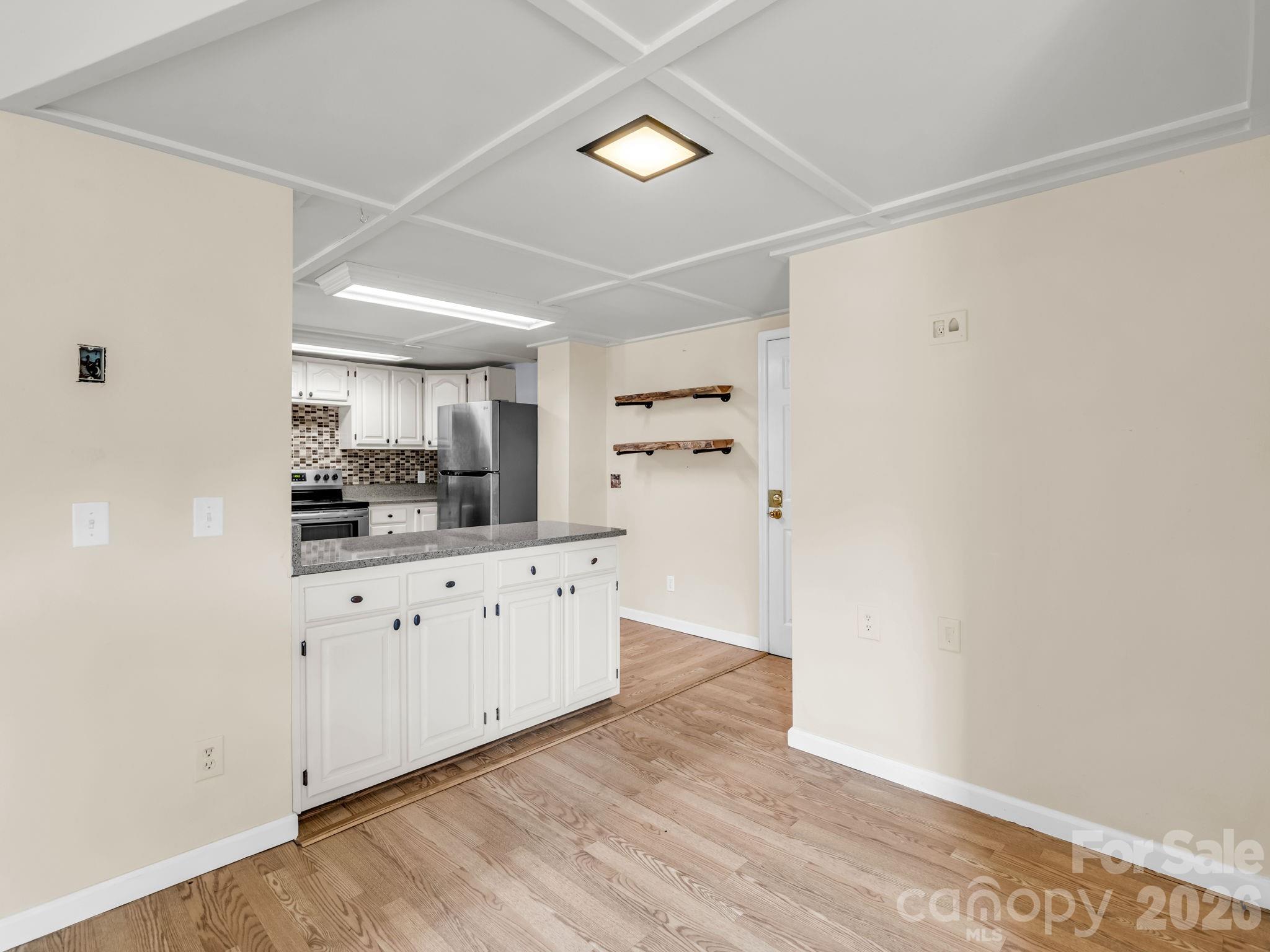 View from living room into kitchen - 117 Willow Way, Hendersonville
