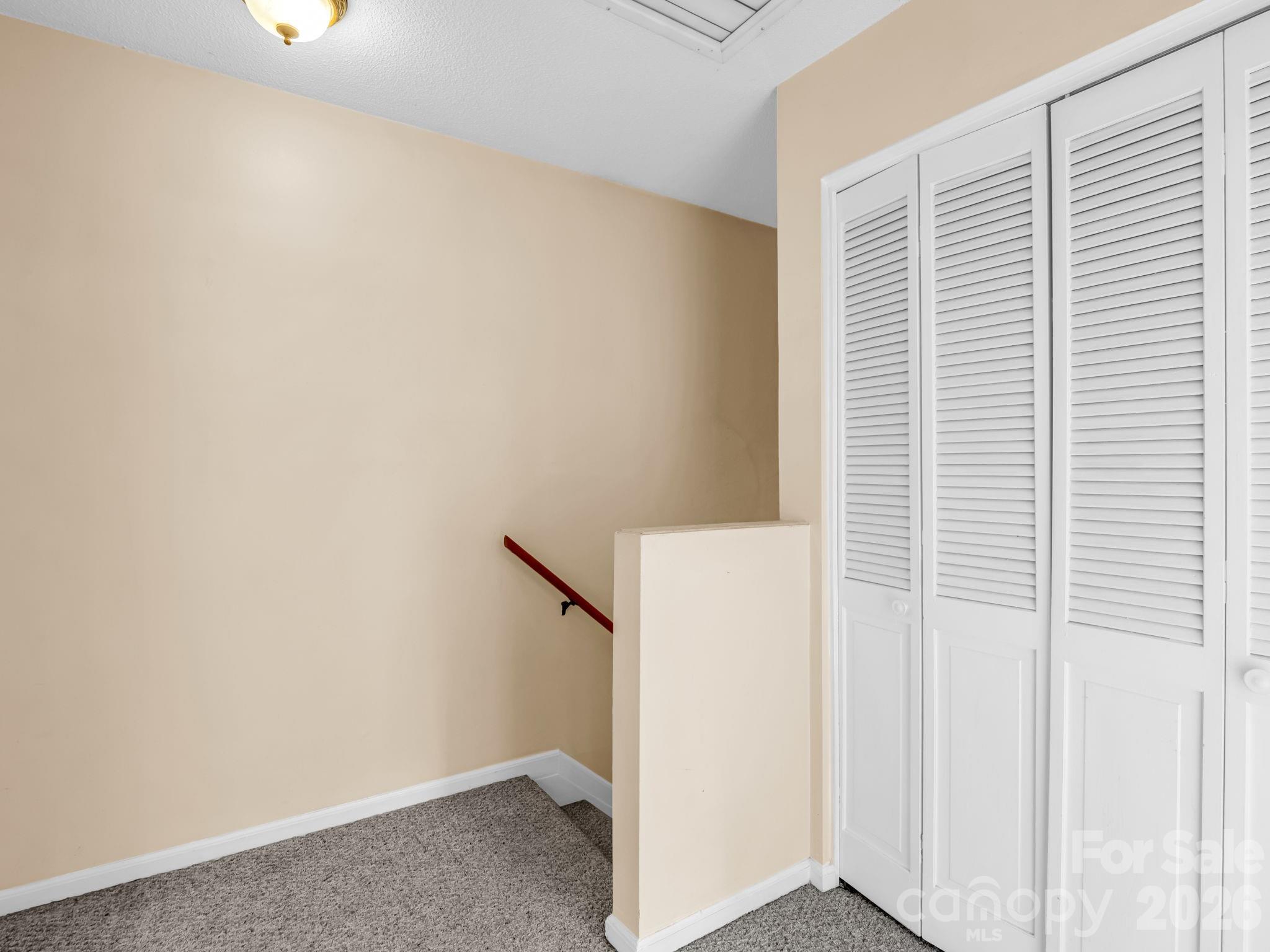 View at landing upstairs, closet to the right, whole house attic fan just above - 117 Willow Way, Hendersonville