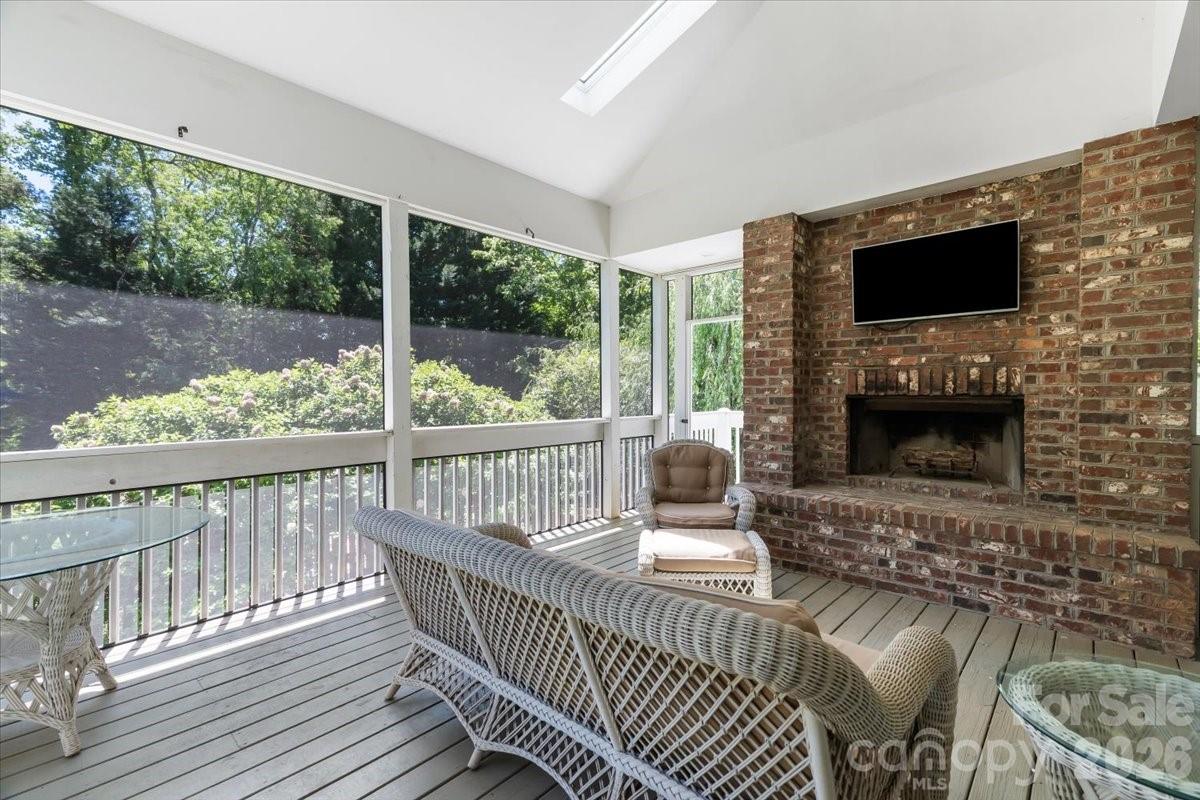 Cozy back porch with wood-burning fireplace - 126 Carolina Bluebird Loop, Arden