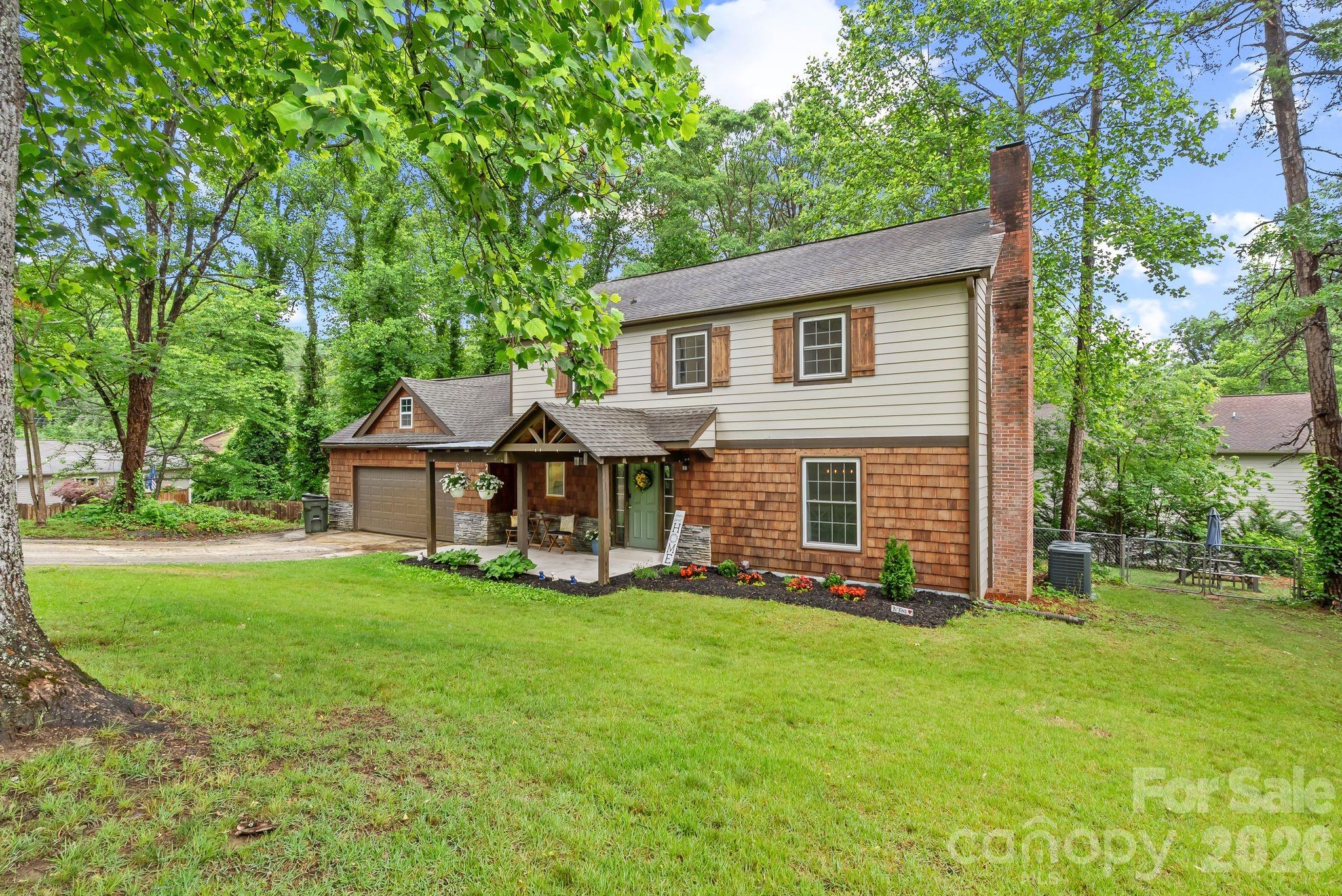 On .44 acres with a lightly wooded parklike setting in the charming community of Beechwood Lakes. - 4 Beechwood Lakes Drive, Hendersonville
