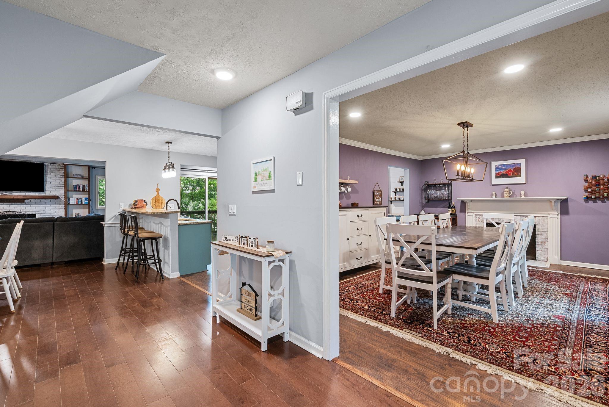 To the right is the formal dining room, straight ahead is the open living area with kitchen. - 4 Beechwood Lakes Drive, Hendersonville