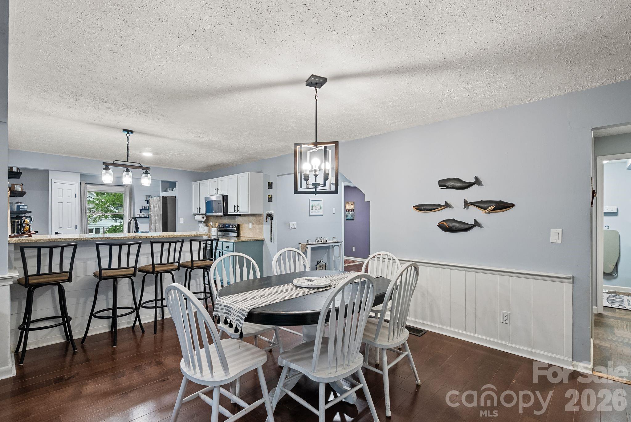 Another ample eating area is located in the open space between the kitchen and den. - 4 Beechwood Lakes Drive, Hendersonville