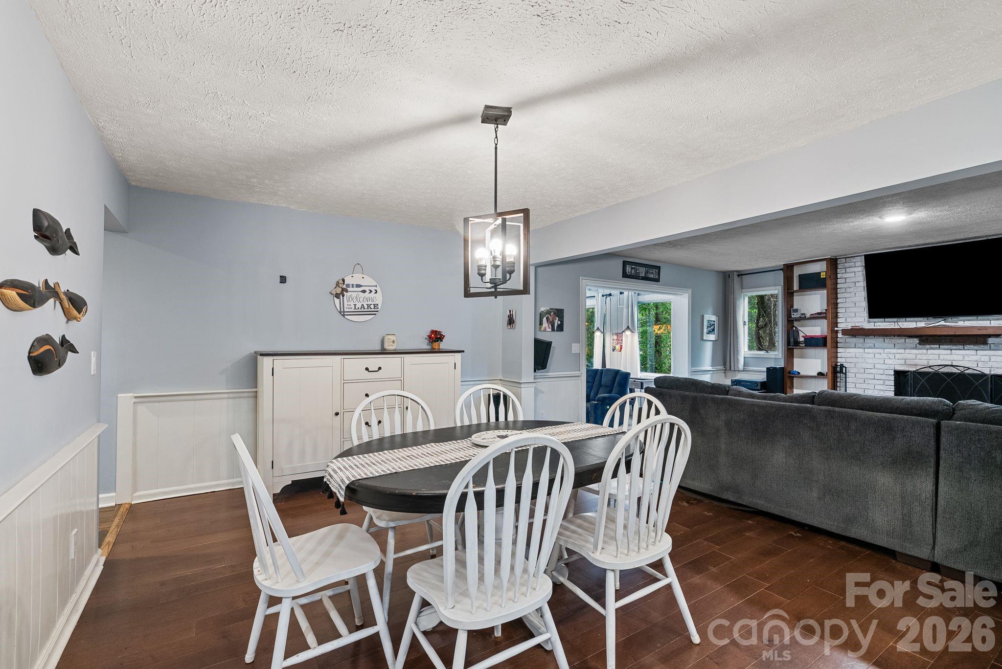Just beyond this dining area lies the den and beyond that step down into the game room / sunroom. - 4 Beechwood Lakes Drive, Hendersonville