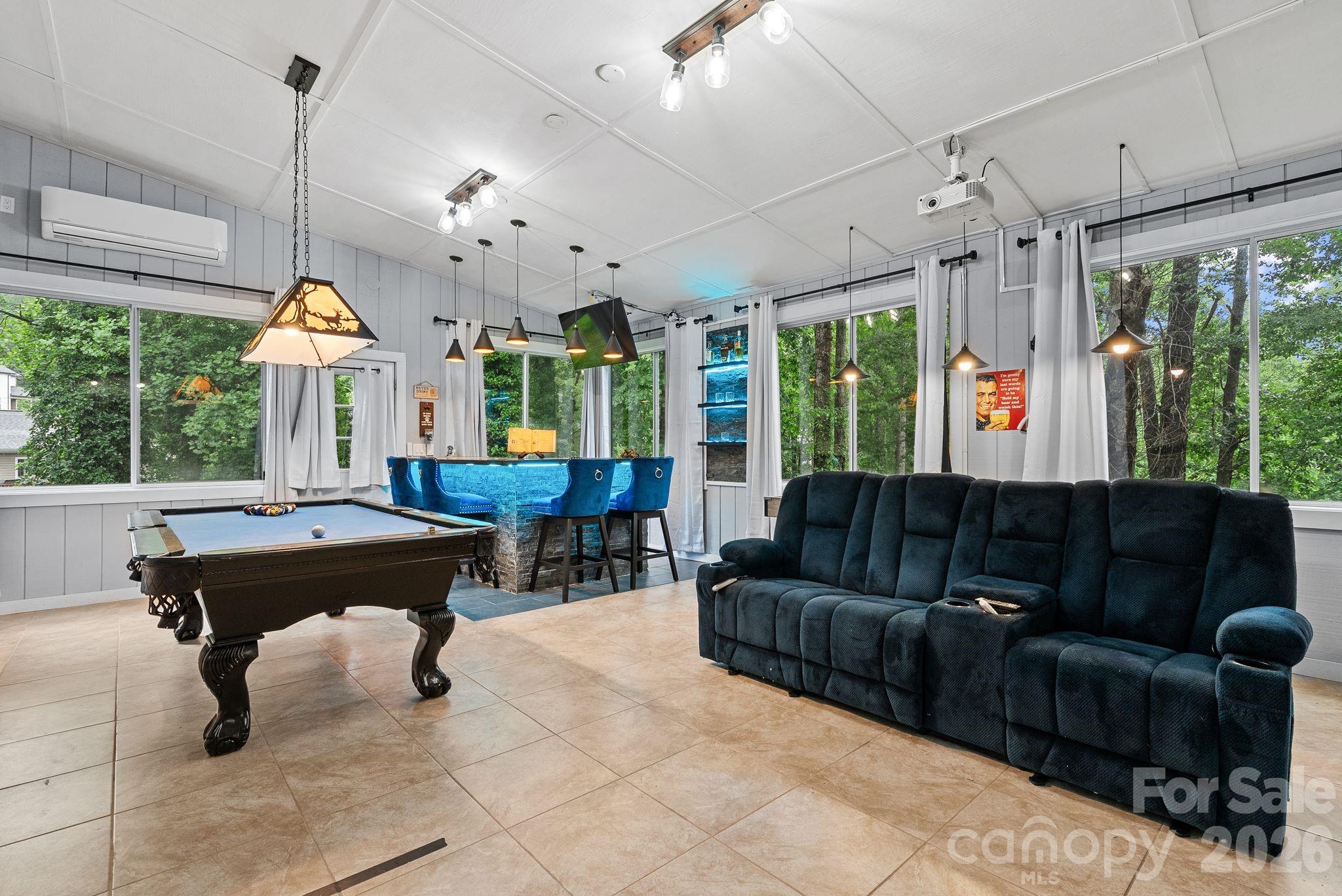 Pool table, shuffleboard table and bar accessories convey. Note the screen above the bar! - 4 Beechwood Lakes Drive, Hendersonville