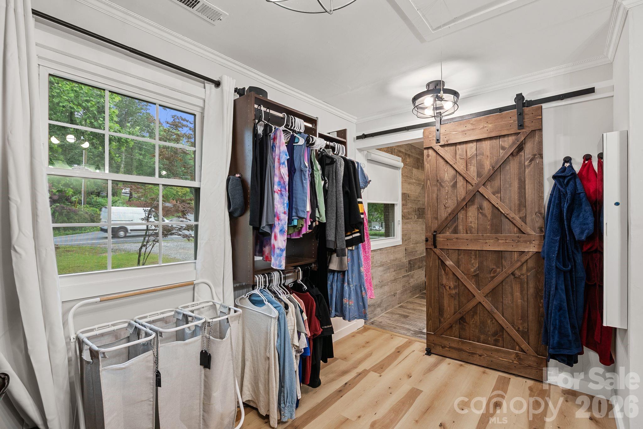 This primary closet used to be a bedroom but was reinvented into the closet of your dreams! - 4 Beechwood Lakes Drive, Hendersonville