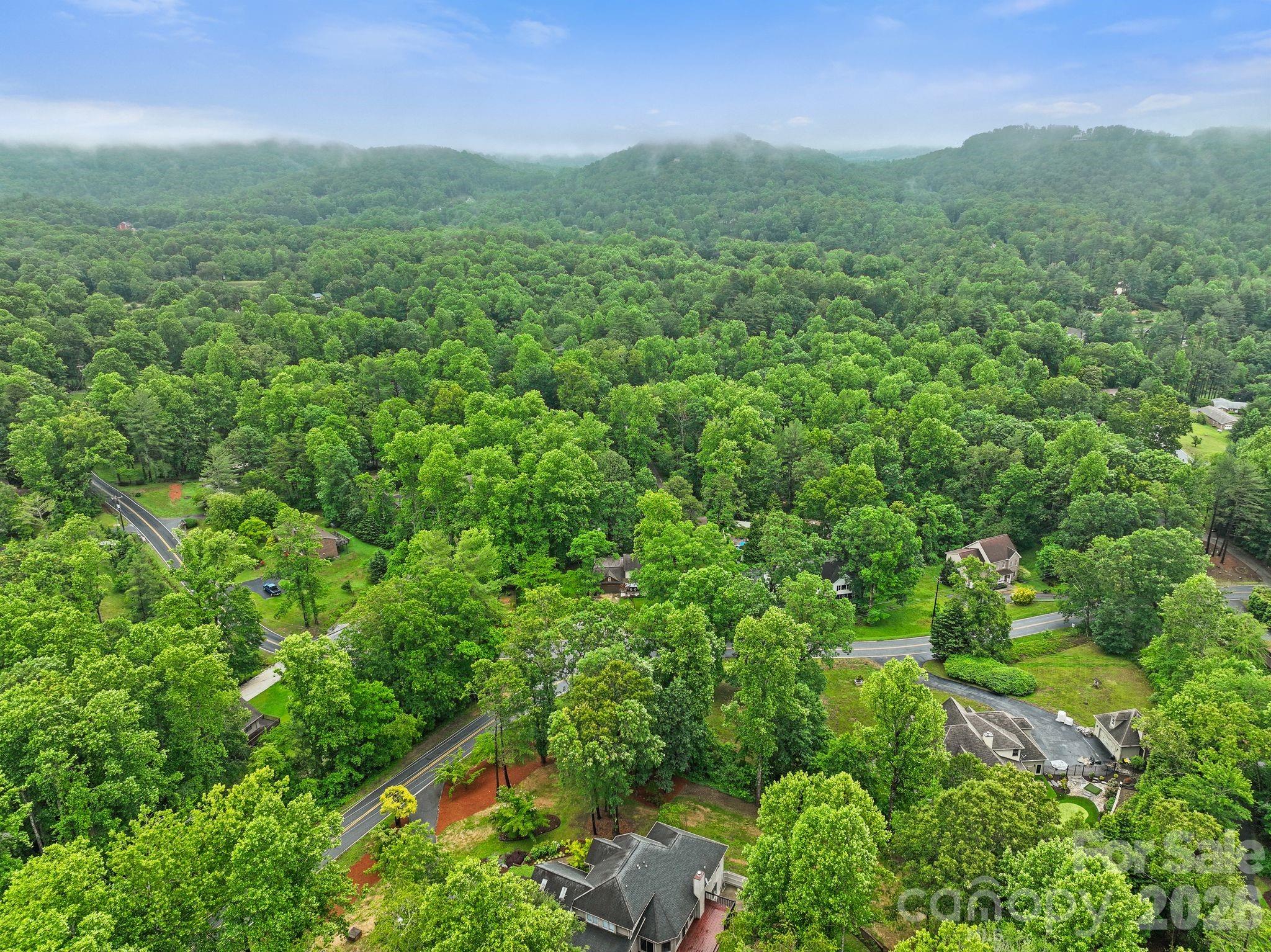 A view from above plus the beautiful surrounding mountains and country of Hendersonville. - 4 Beechwood Lakes Drive, Hendersonville