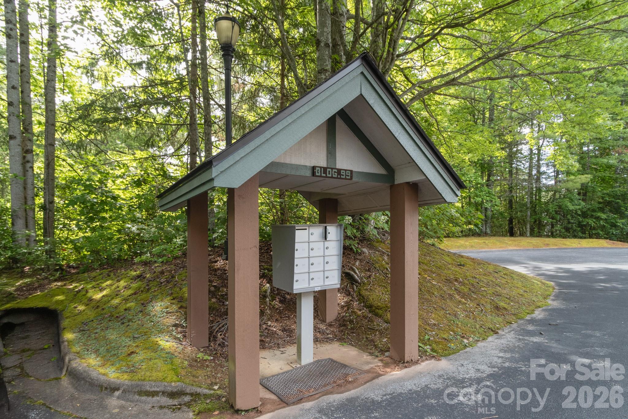 Community Mail Center – Convenient covered mail center serving the building, thoughtfully positioned near parking and easy access points. - 99 Ridgetop Circle, Brevard