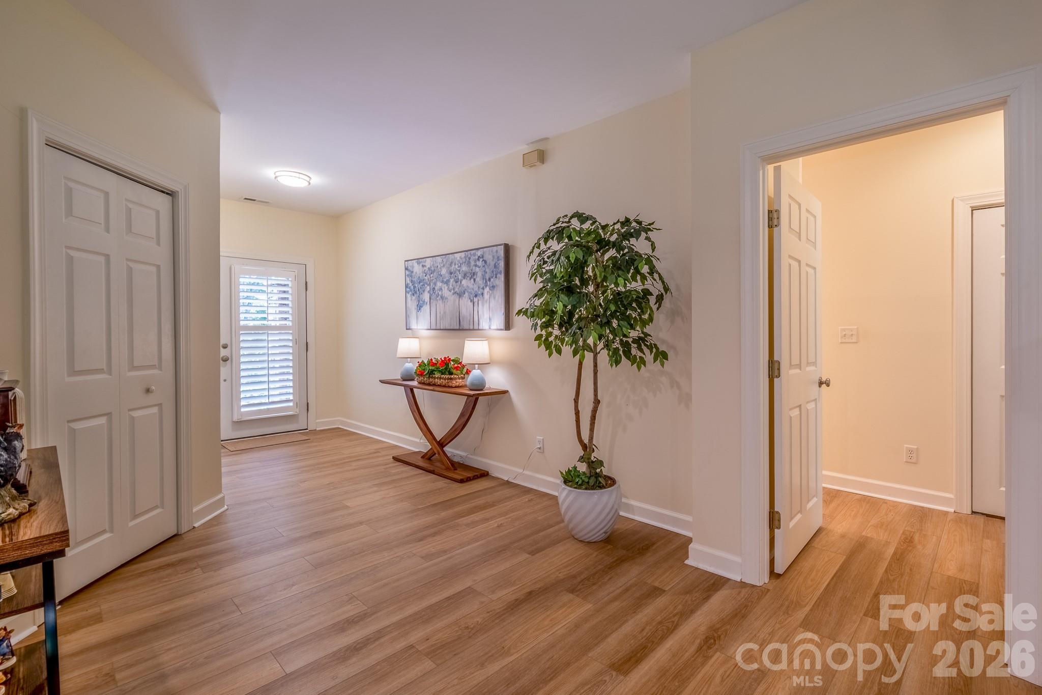 Wide Foyer & Entry Hall – Expansive entry hall with updated flooring, neutral finishes, and welcoming transition into the home’s open living spaces. - 99 Ridgetop Circle, Brevard