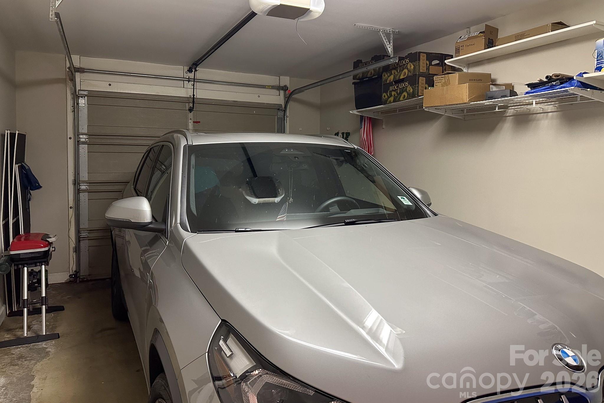 Private One-Car Garage – Attached one-car garage offering secure parking, overhead storage, and additional space for tools or seasonal items. - 99 Ridgetop Circle, Brevard