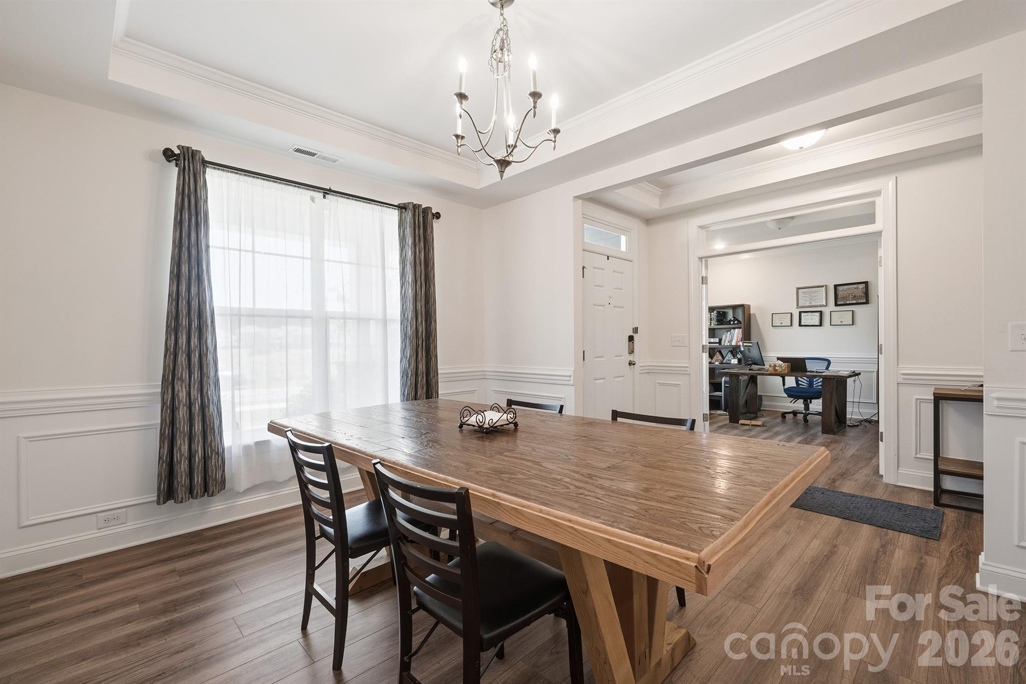 Dining Room Featuring Tray Ceilings and Wainscoting - 282 Bouchard Drive, Waxhaw