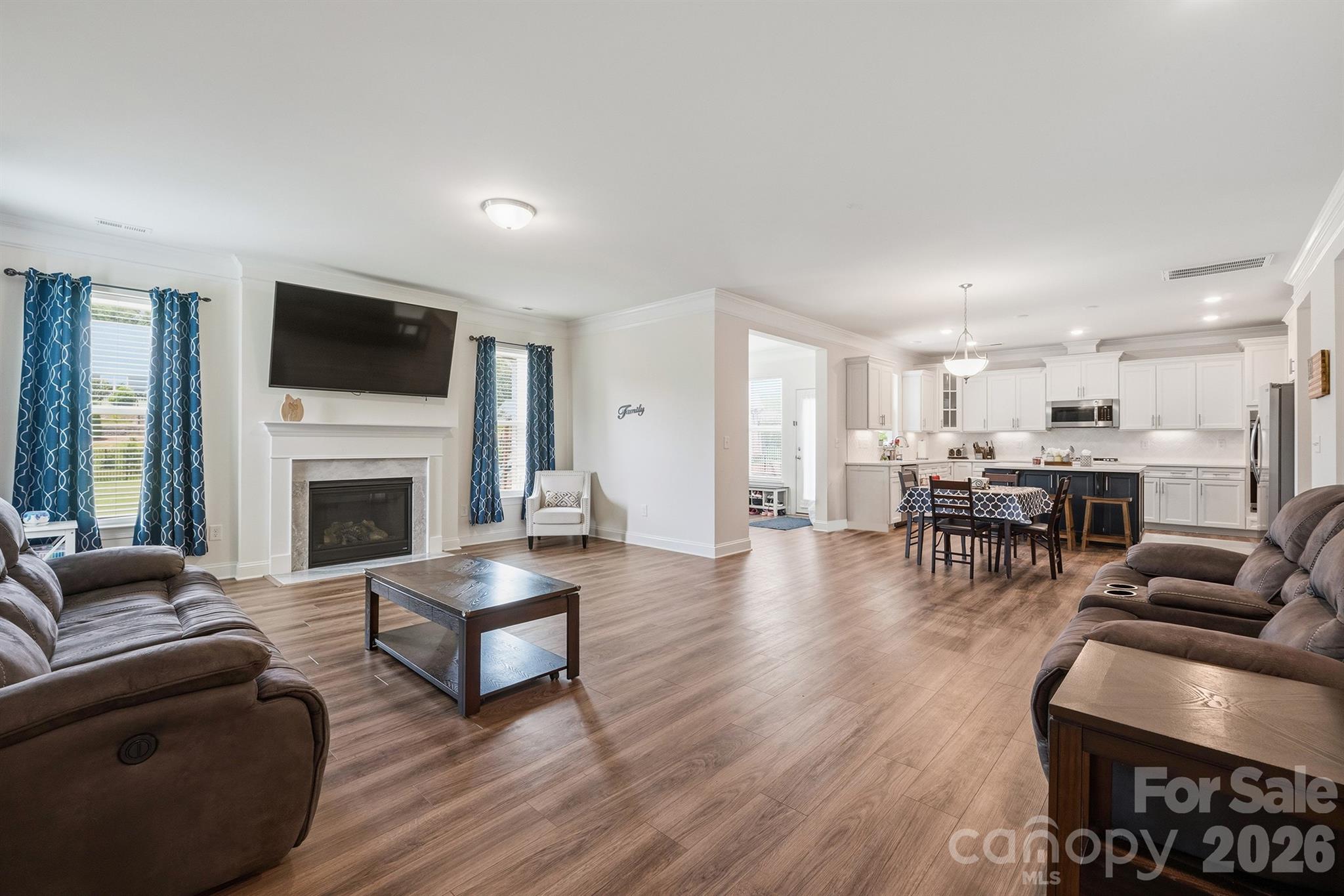 Open Floor Plan - Living Room with Gas Fireplace, Breakfast Nook, Kitchen, and Sunroom - 282 Bouchard Drive, Waxhaw