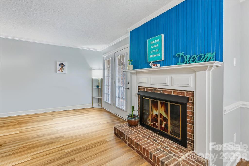 The main floor features beautiful luxury vinyl plank flooring throughout with no carpet, offering a stylish, durable, and low-maintenance living space that complements any décor - 806 Colony Oaks Drive, Monroe