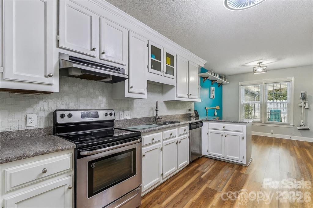 Thoughtfully designed kitchen with abundant cabinet storage, maximizing both functionality and organization - 806 Colony Oaks Drive, Monroe