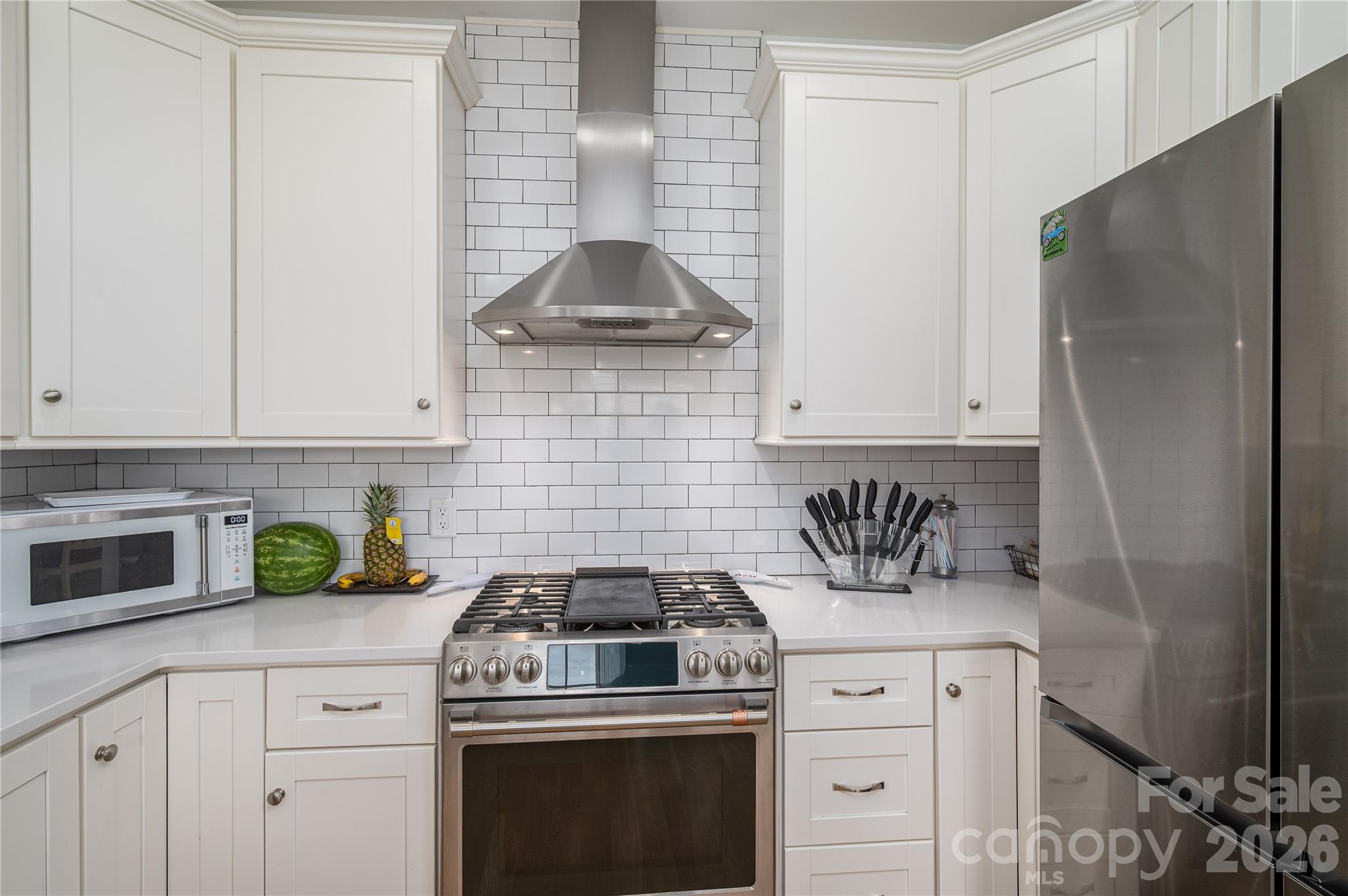 Culinary Kitchen includes hood vent, gas stove, upgraded fridge - 2725 Eagle Drive, Lincolnton