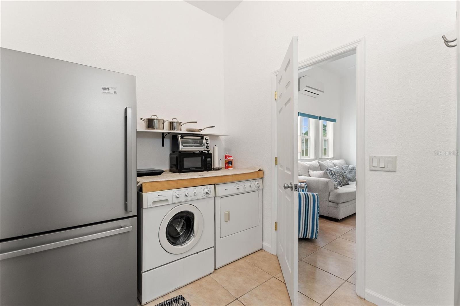 Laundry Area with refrigerator & microwave - 2336 ST GEORGE DR, DAVENPORT