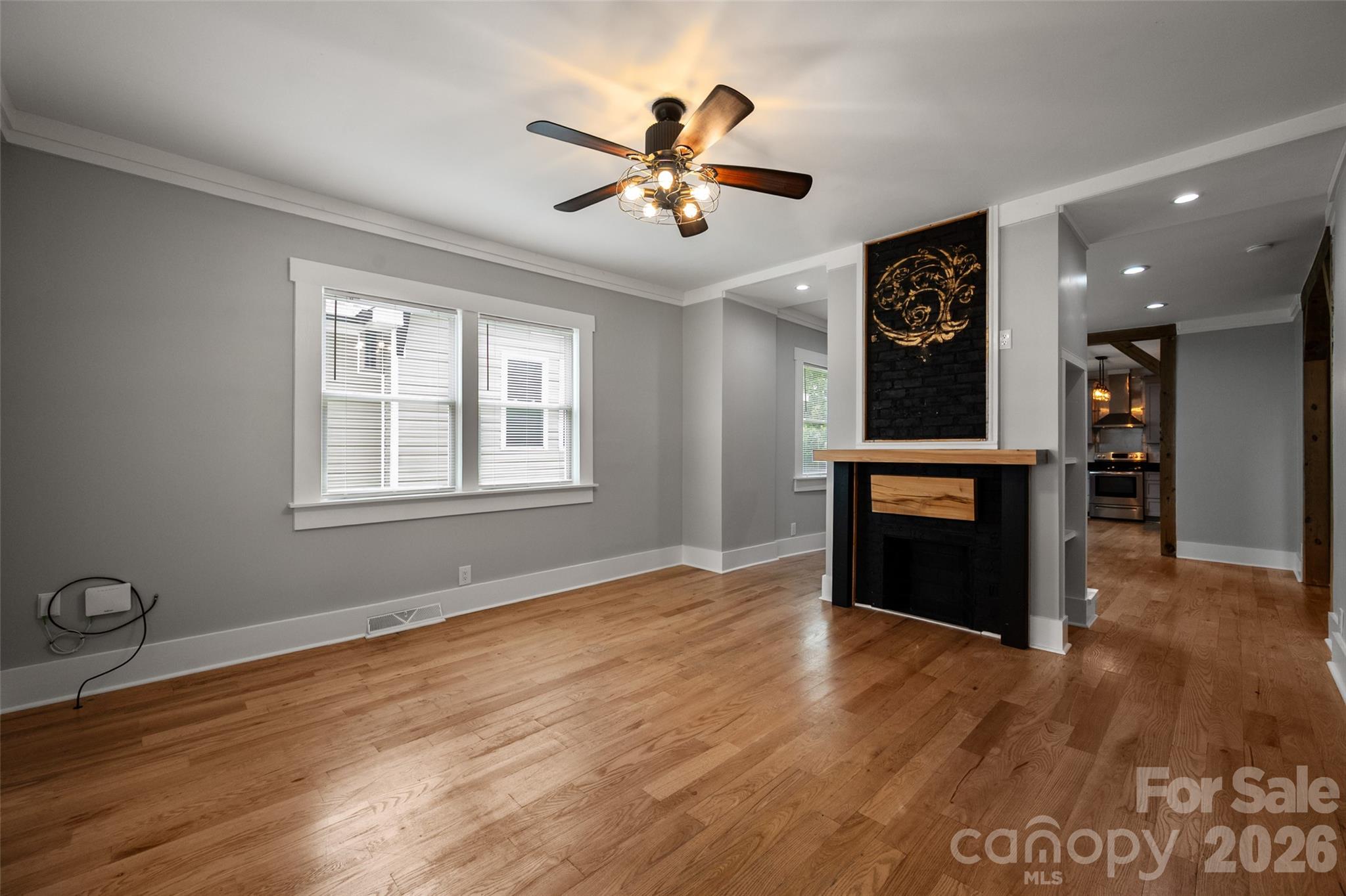 Double sided fireplace in the living room - 174 Tournament Drive SW, Concord