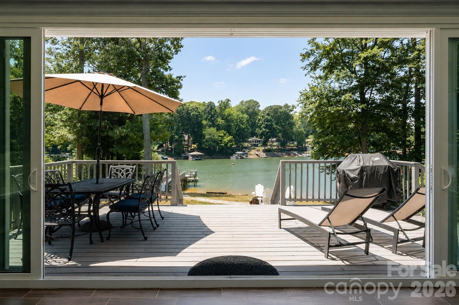 Experience the best of indoor outdoor living at this lakeside retreat in a prime Mooresville location! - 383 Sundown Road, Mooresville