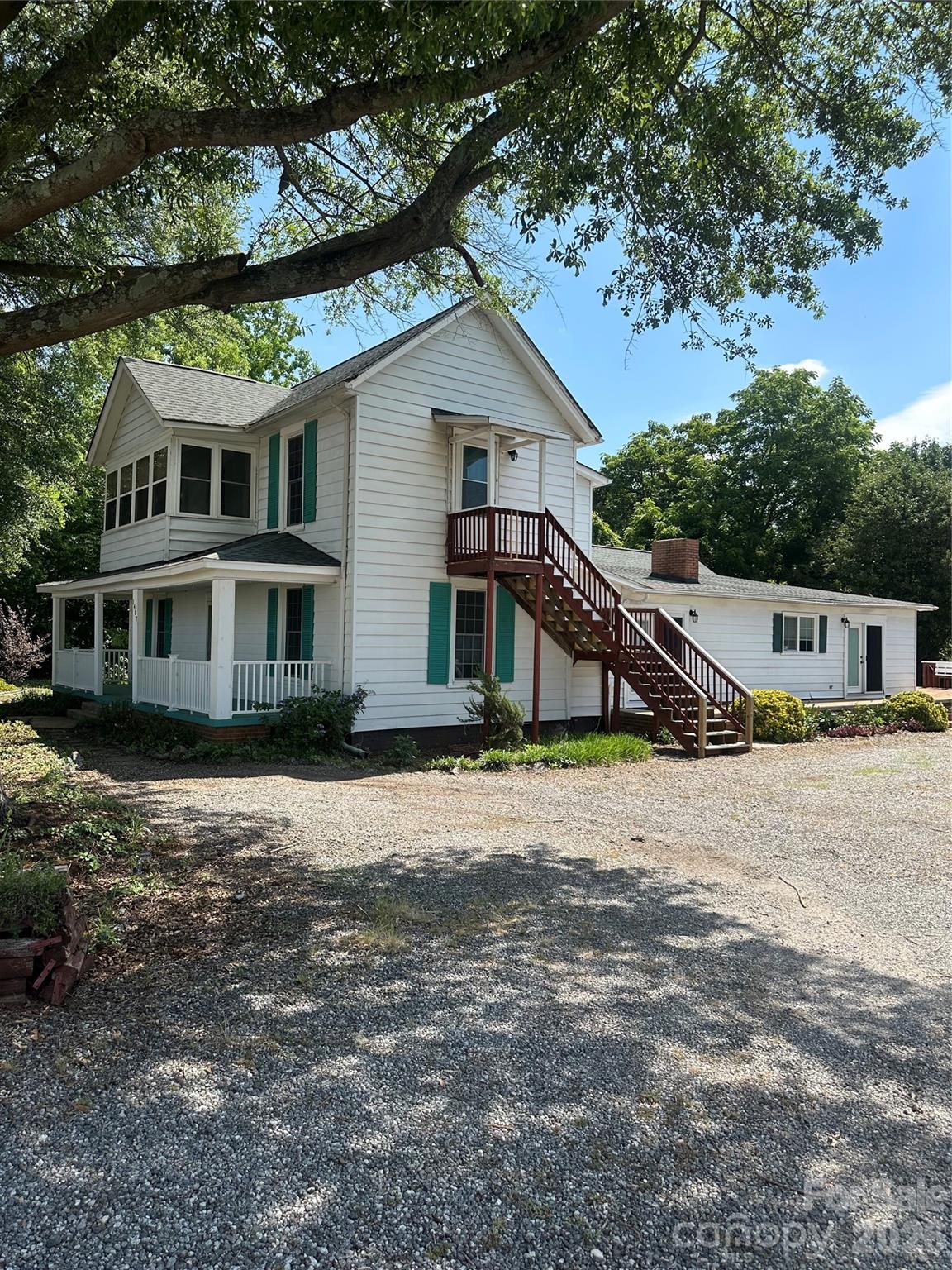 Street view entering drive way. - 1407 N College Avenue, Newton