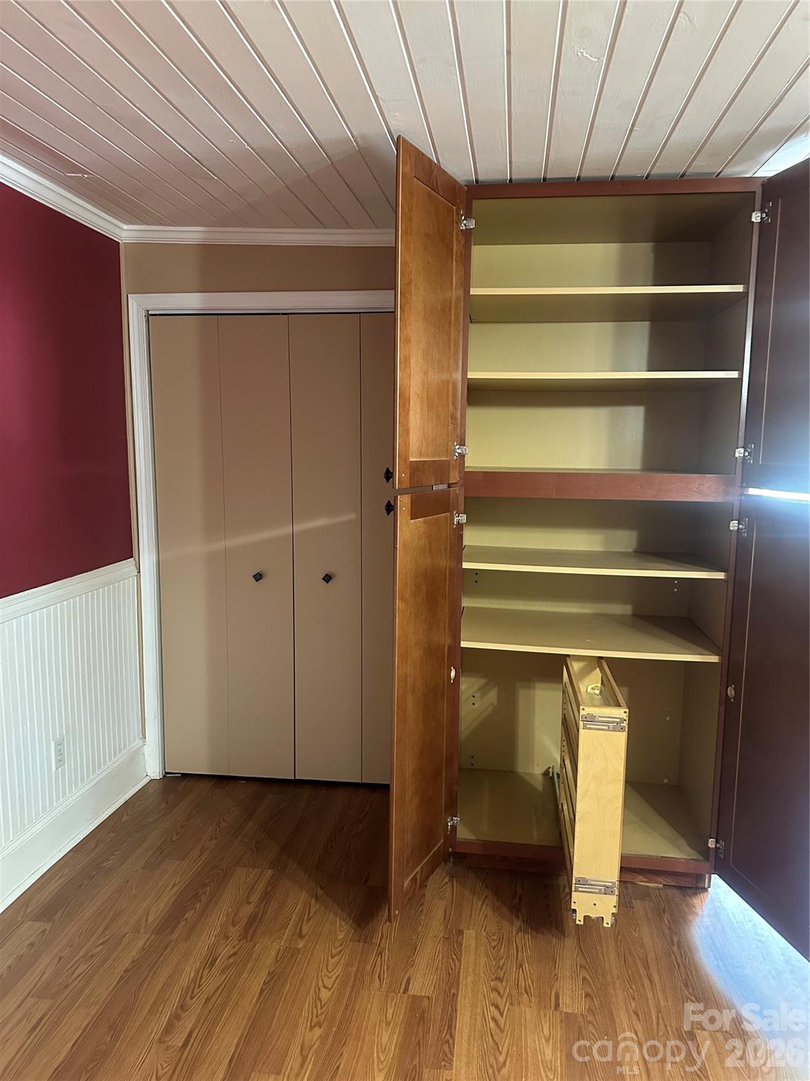 cabinets have modern pull out shelf in pantry - 1407 N College Avenue, Newton
