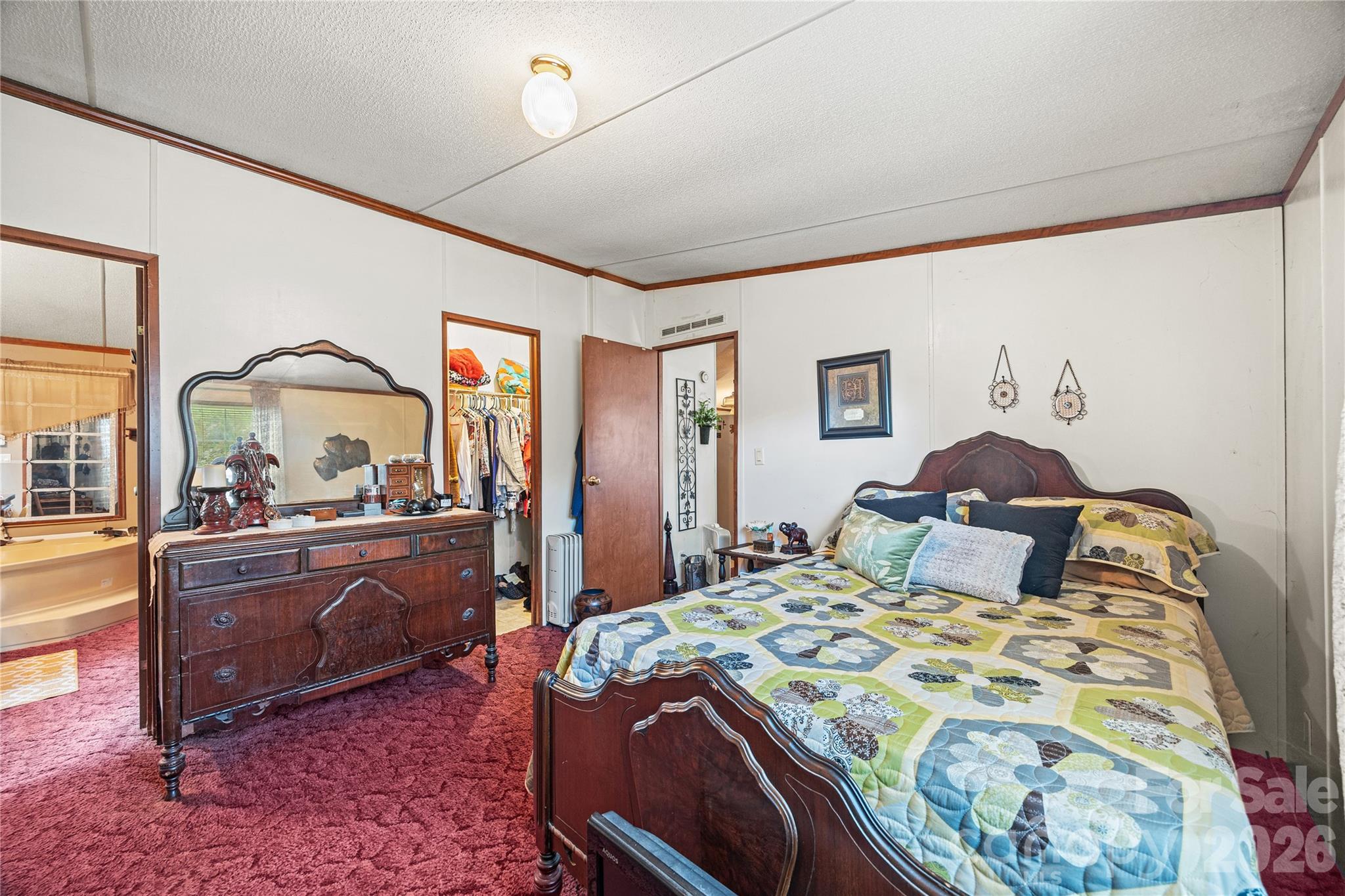 Primary Bedroom with a split floorplan. - 323 Carlyle Road, Troutman