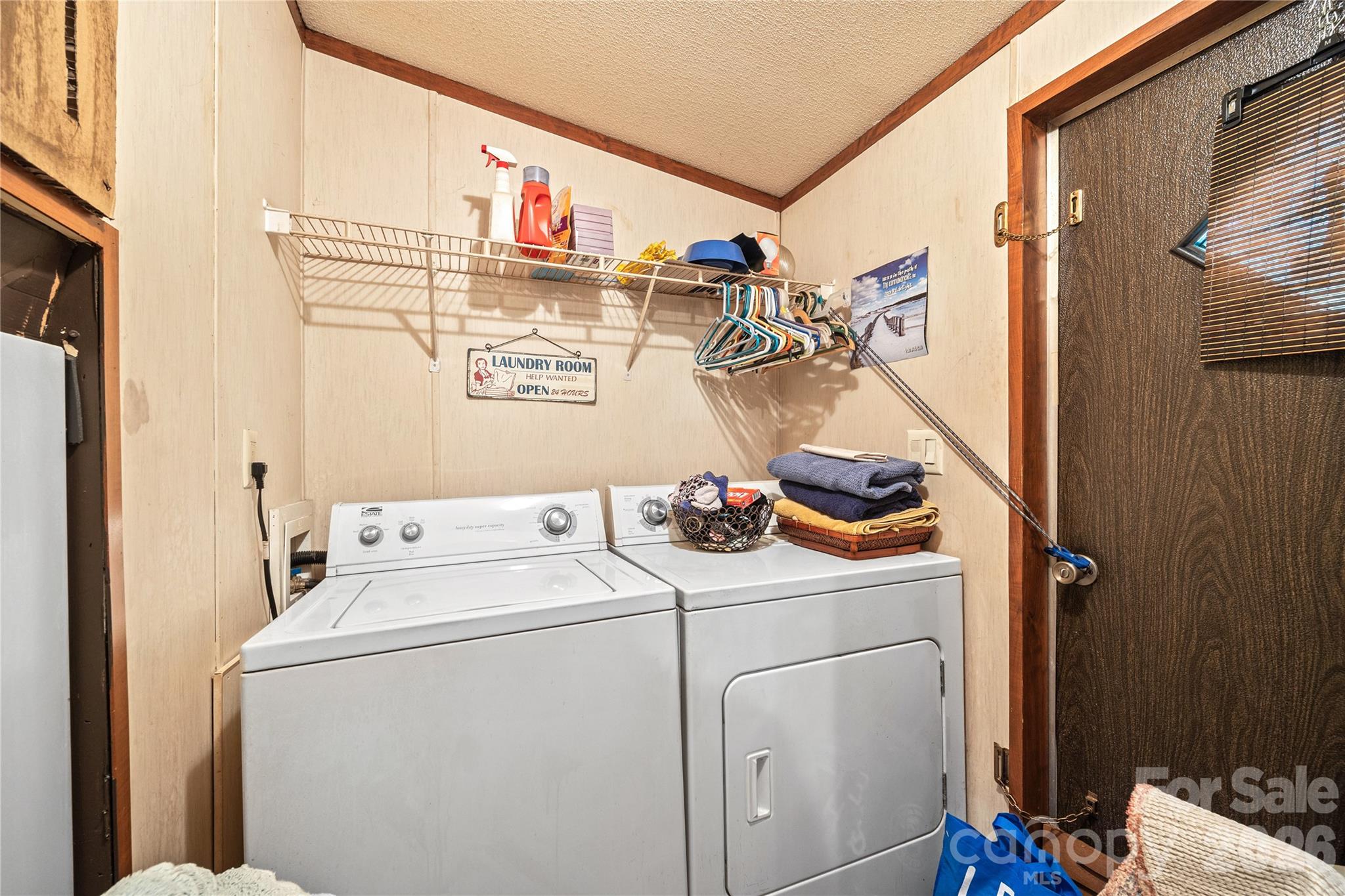 Laundry room with backyard entry - 323 Carlyle Road, Troutman