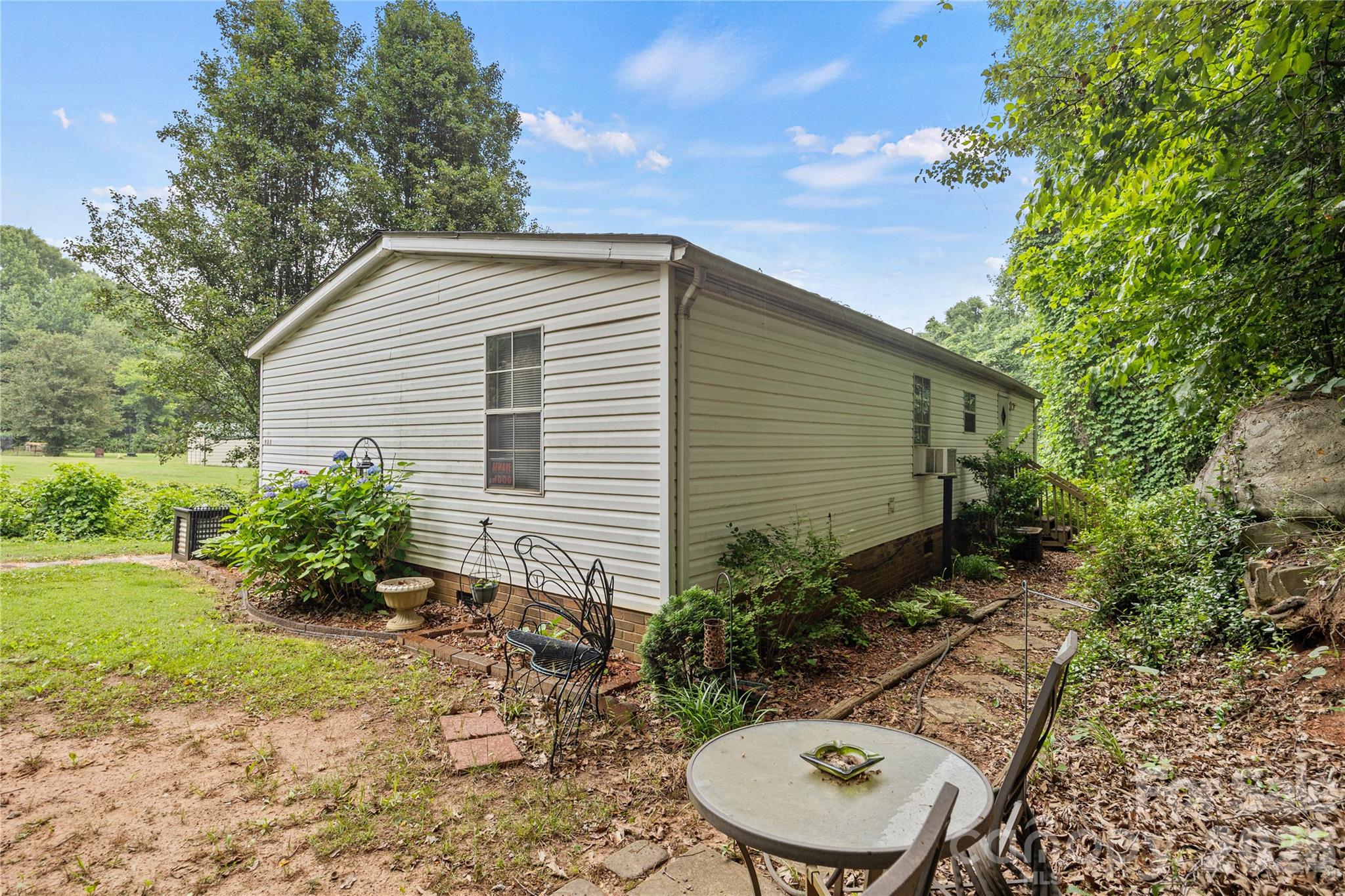 Walkway to the back door from driveway. - 323 Carlyle Road, Troutman