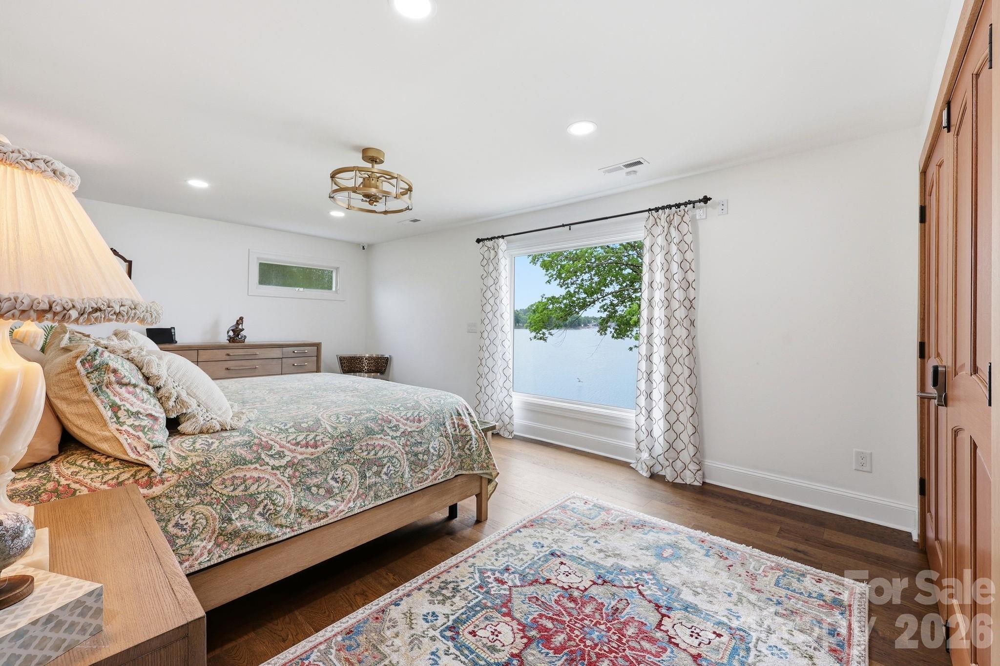 Primary bedroom with picture window - 420 Skysail Road, Salisbury