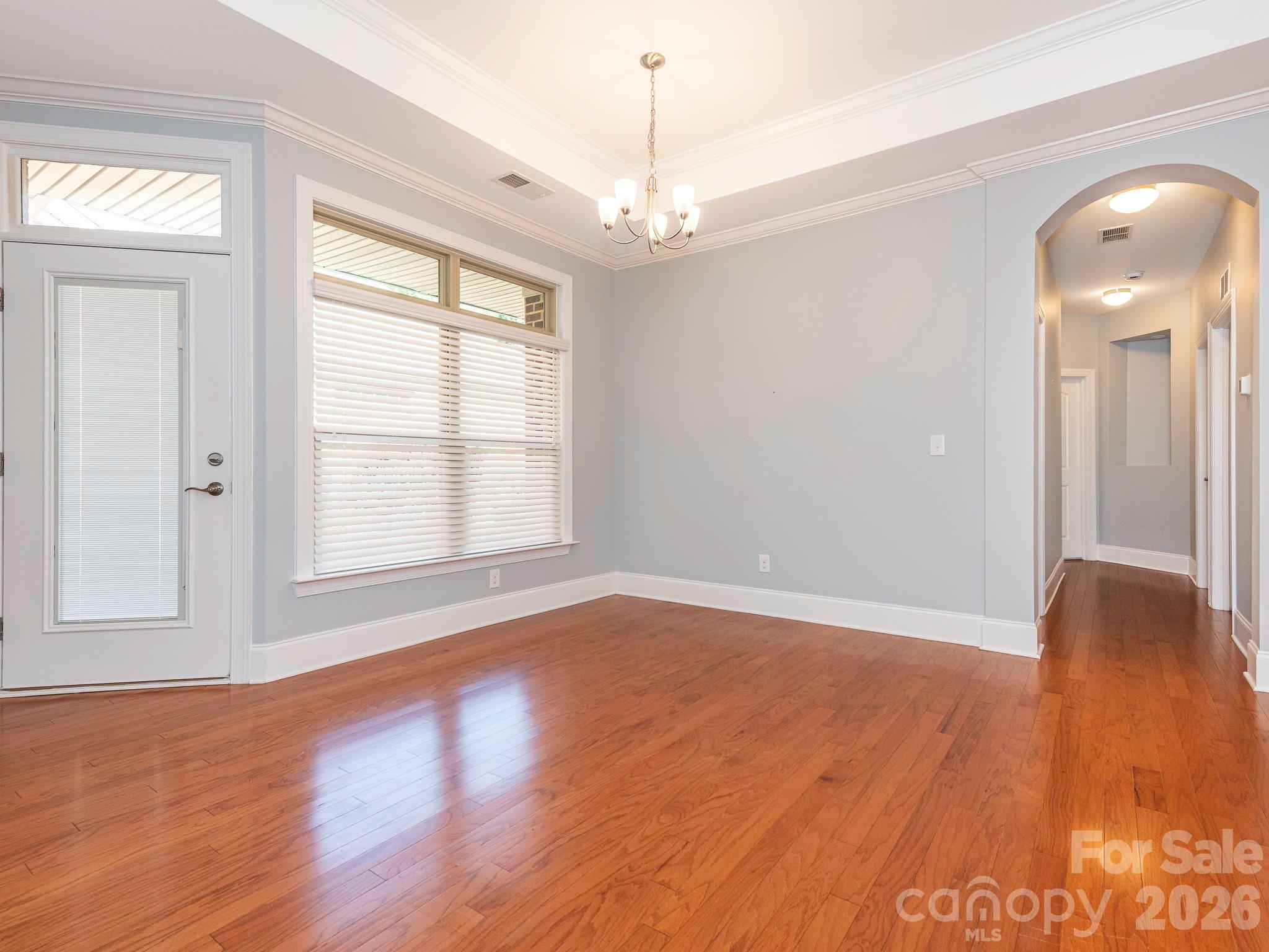 Large dining area is adjacent to the kitchen. The door on the left leads to the patio. - 4534 Ideal Way, Harrisburg